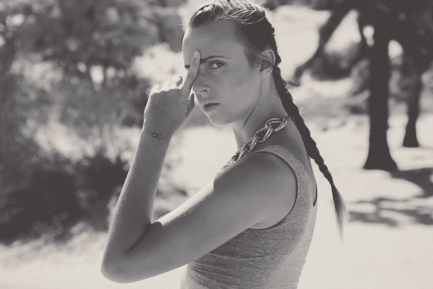 Woman with infinity tattoo and braid HD Wallpaper
