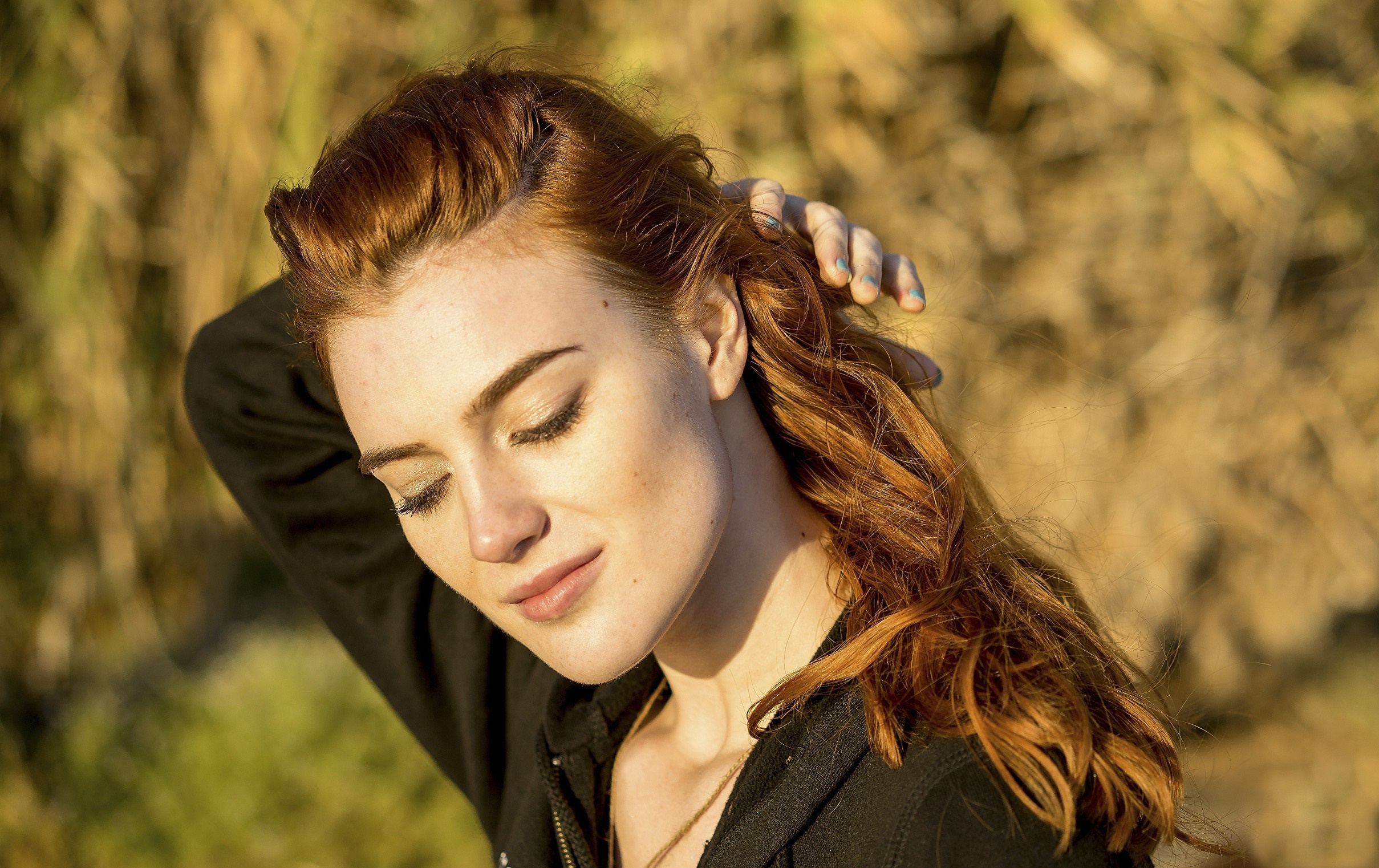 Redhead woman with eyes closed touching her hair HD Wallpaper