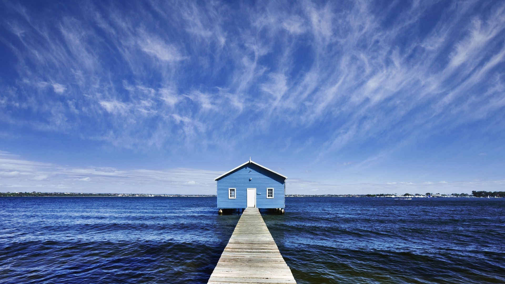 Blue boathouse on a pier over the water HD Wallpaper