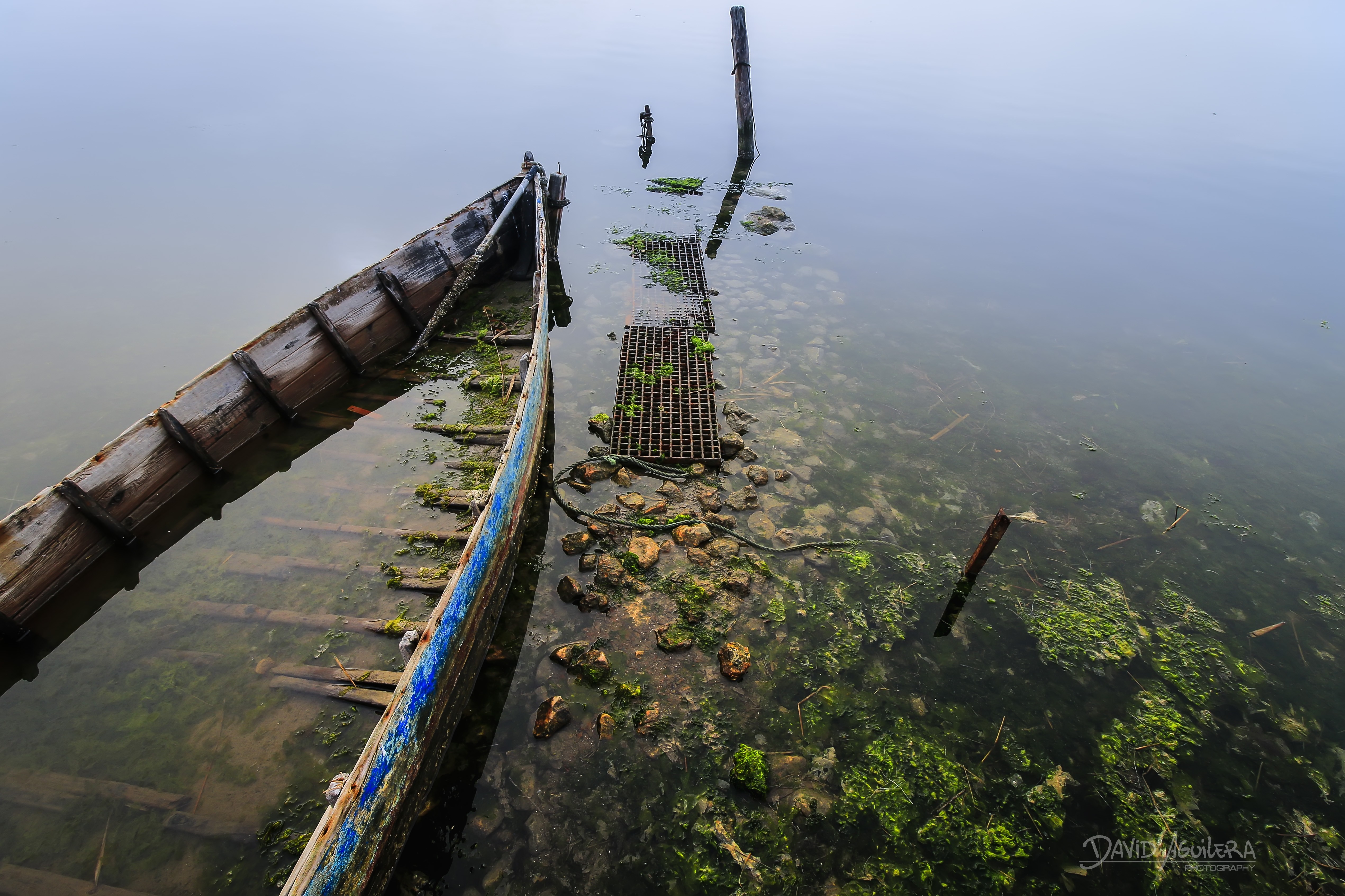 Sunken boat near a metal walkway in foggy water HD Wallpaper