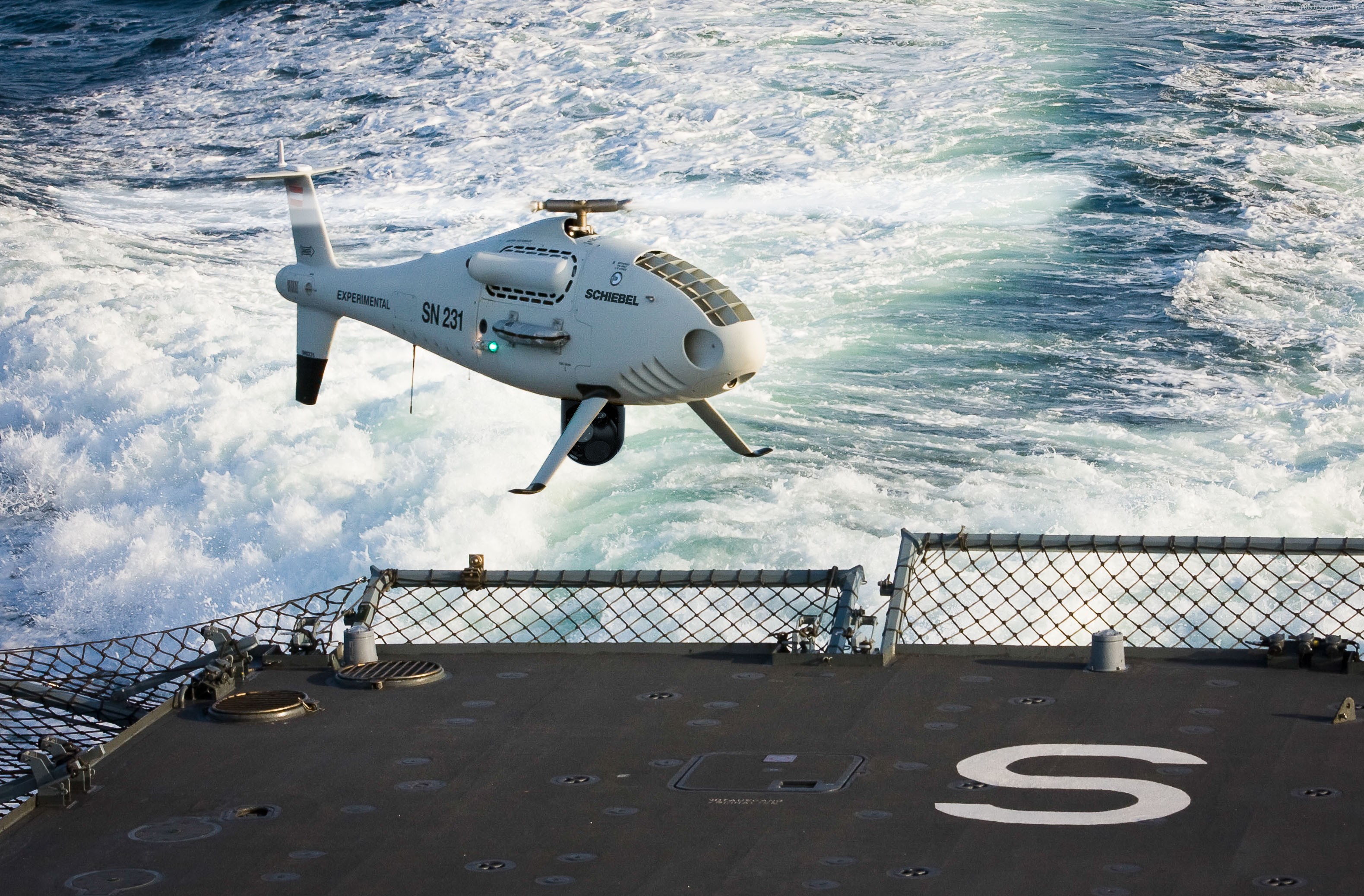 Schiebel S-100 Camcopter drone over water HD Wallpaper
