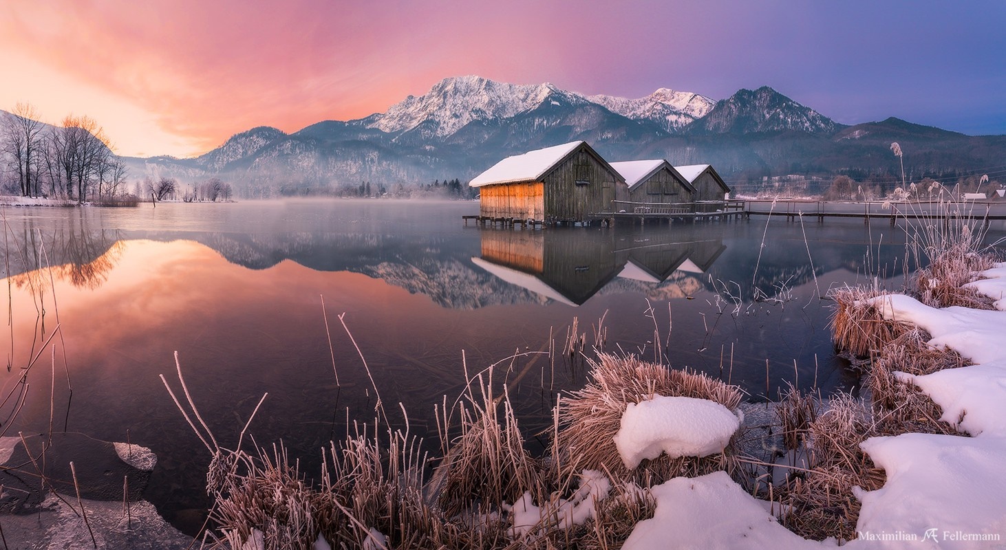 Winter sunrise over a snowy mountain lake with boathouses HD Wallpaper