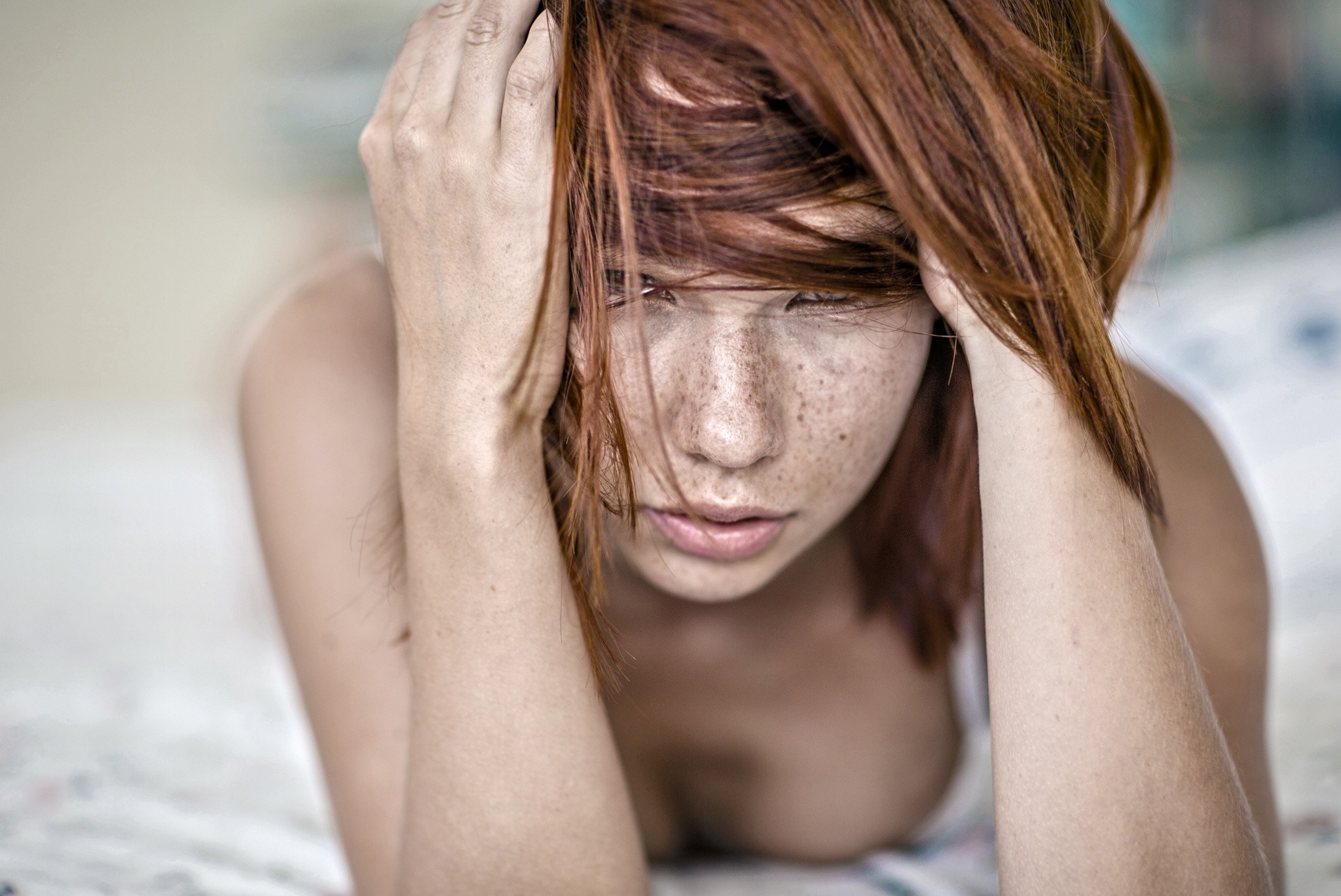 Woman with red hair and freckles lying down HD Wallpaper