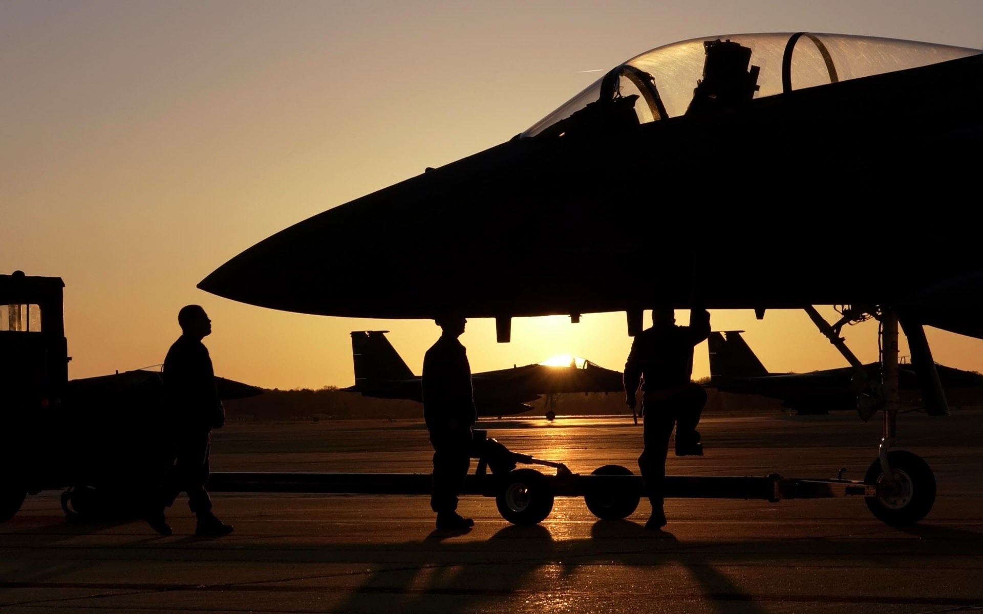 Military personnel and fighter jets at sunset HD Wallpaper