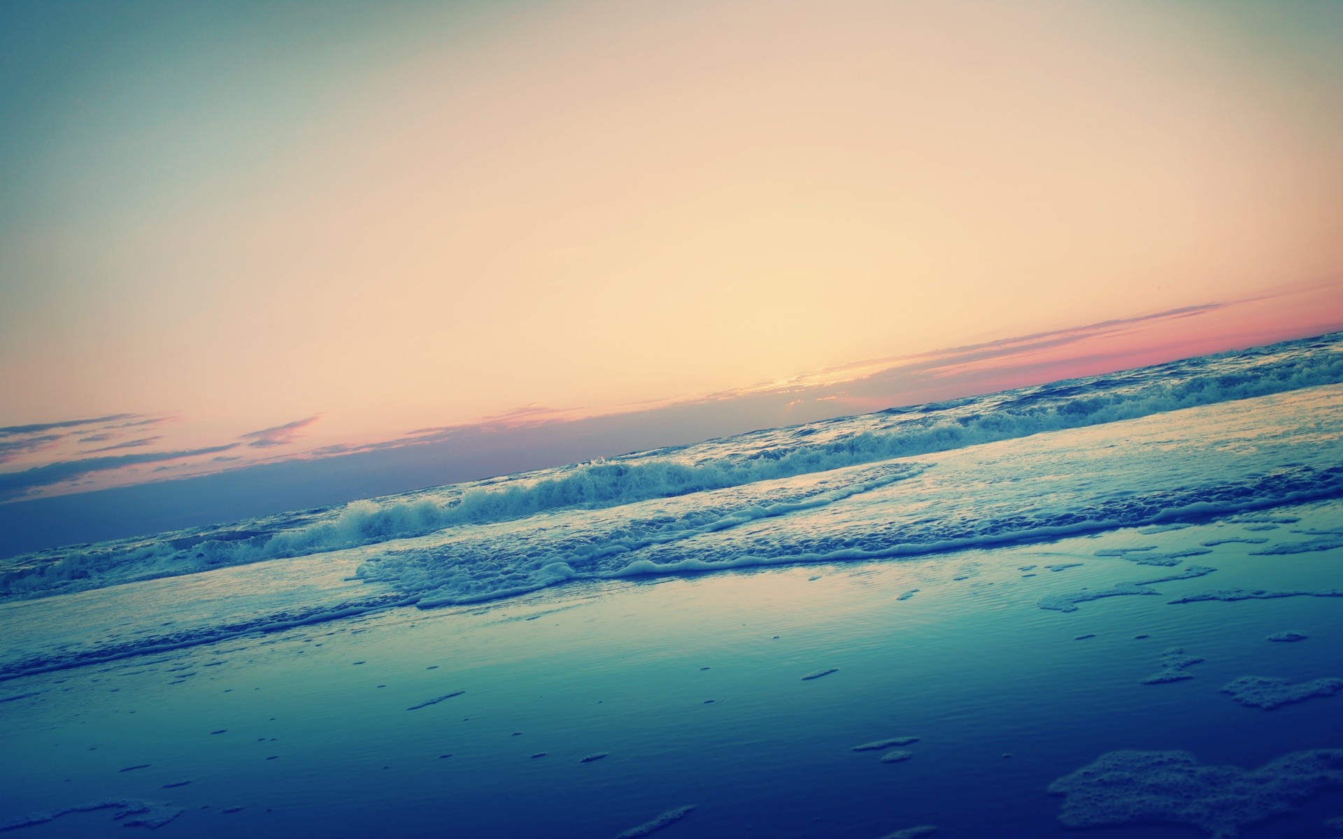 Ocean waves at sunset with colorful sky HD Wallpaper