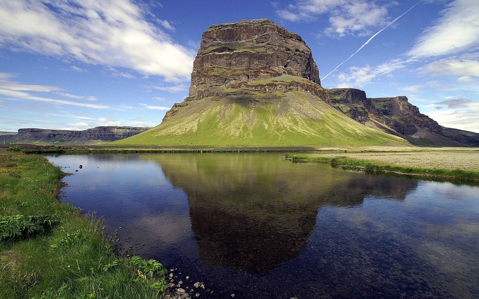 Mountain reflected in a calm lake under a cloudy sky HD Wallpaper