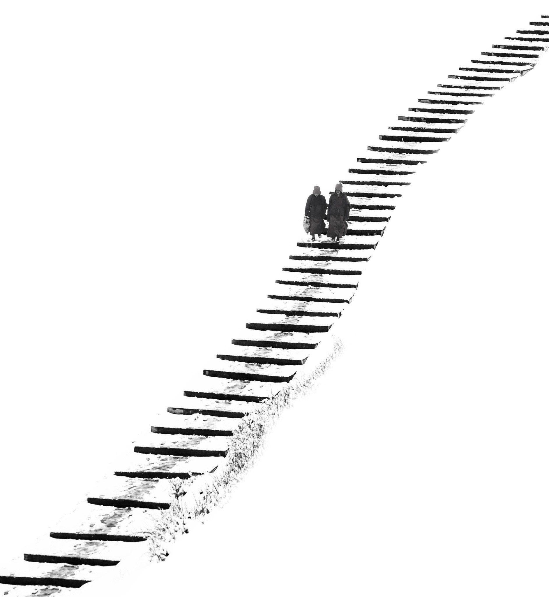Two people walking up snowy stairs HD Wallpaper