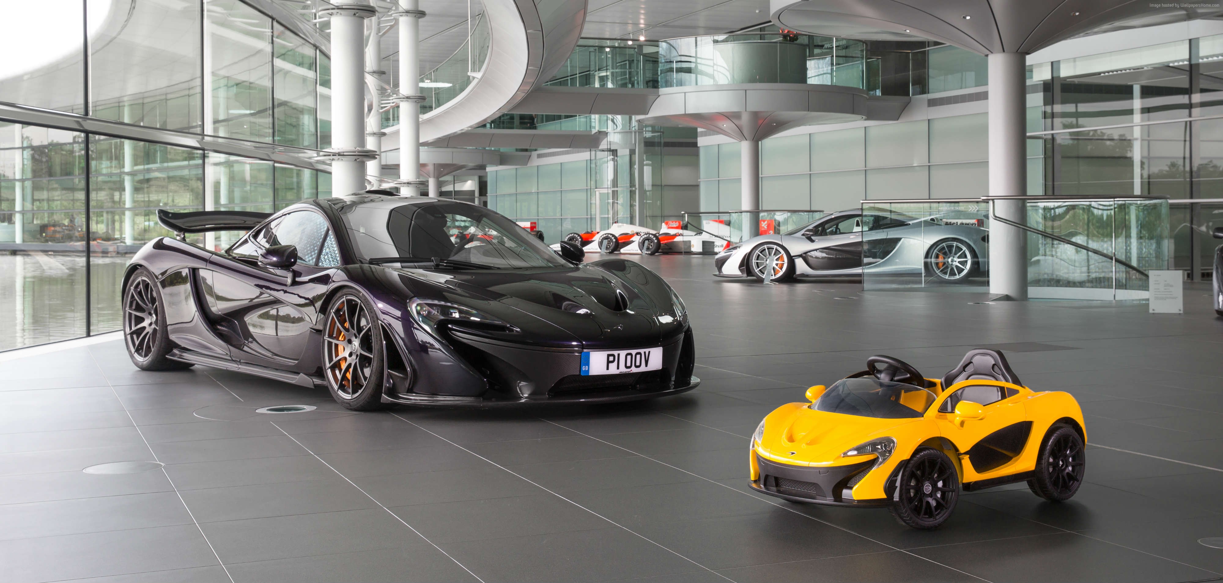 McLaren P1 and toy car in showroom HD Wallpaper