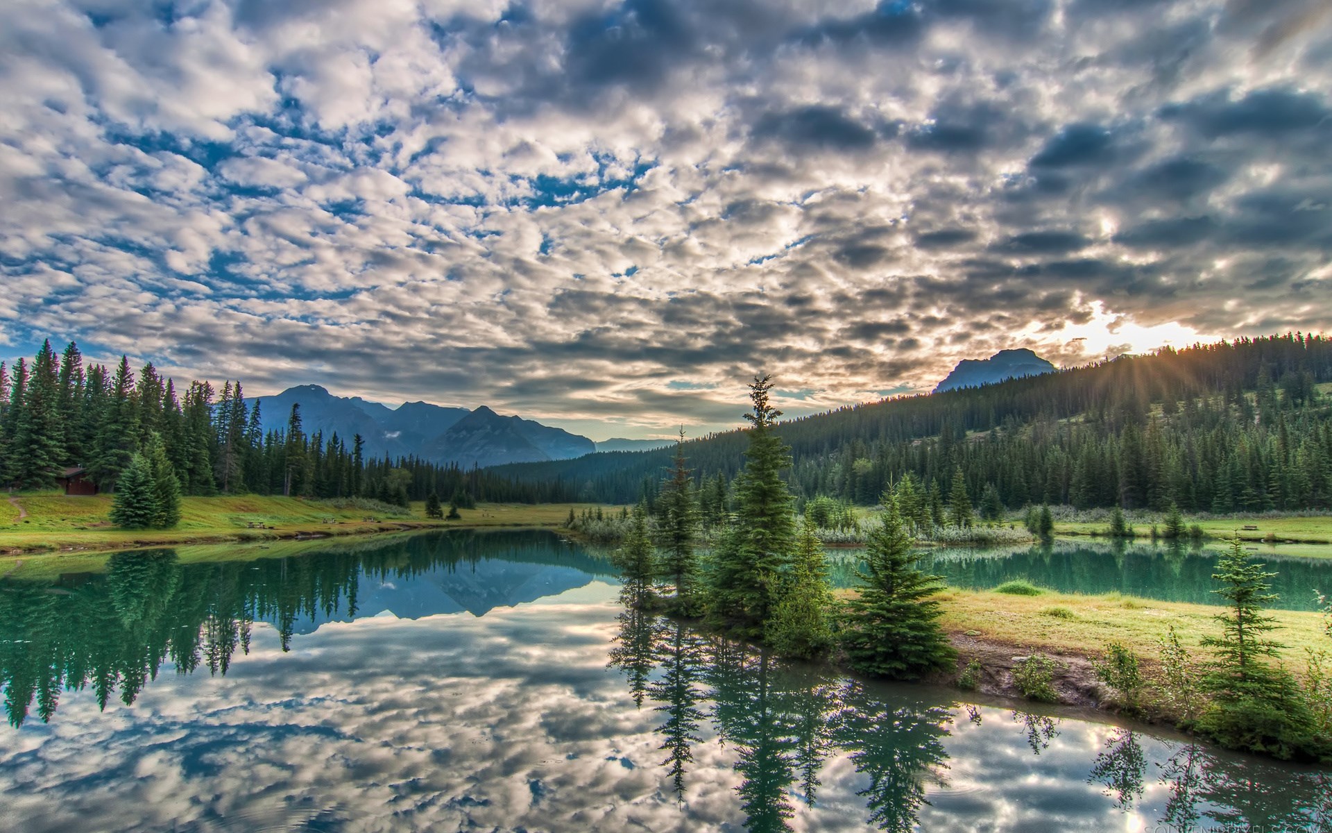 Mountain lake with pine trees and cloudy sky reflection HD Wallpaper