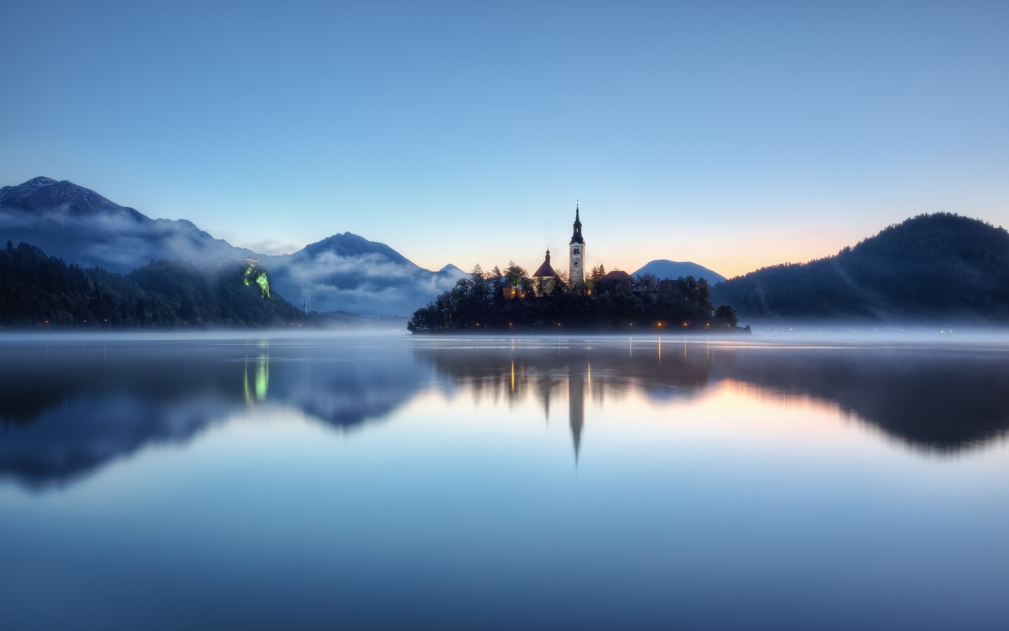 Island church reflection in misty lake at dawn, Slovenia HD Wallpaper