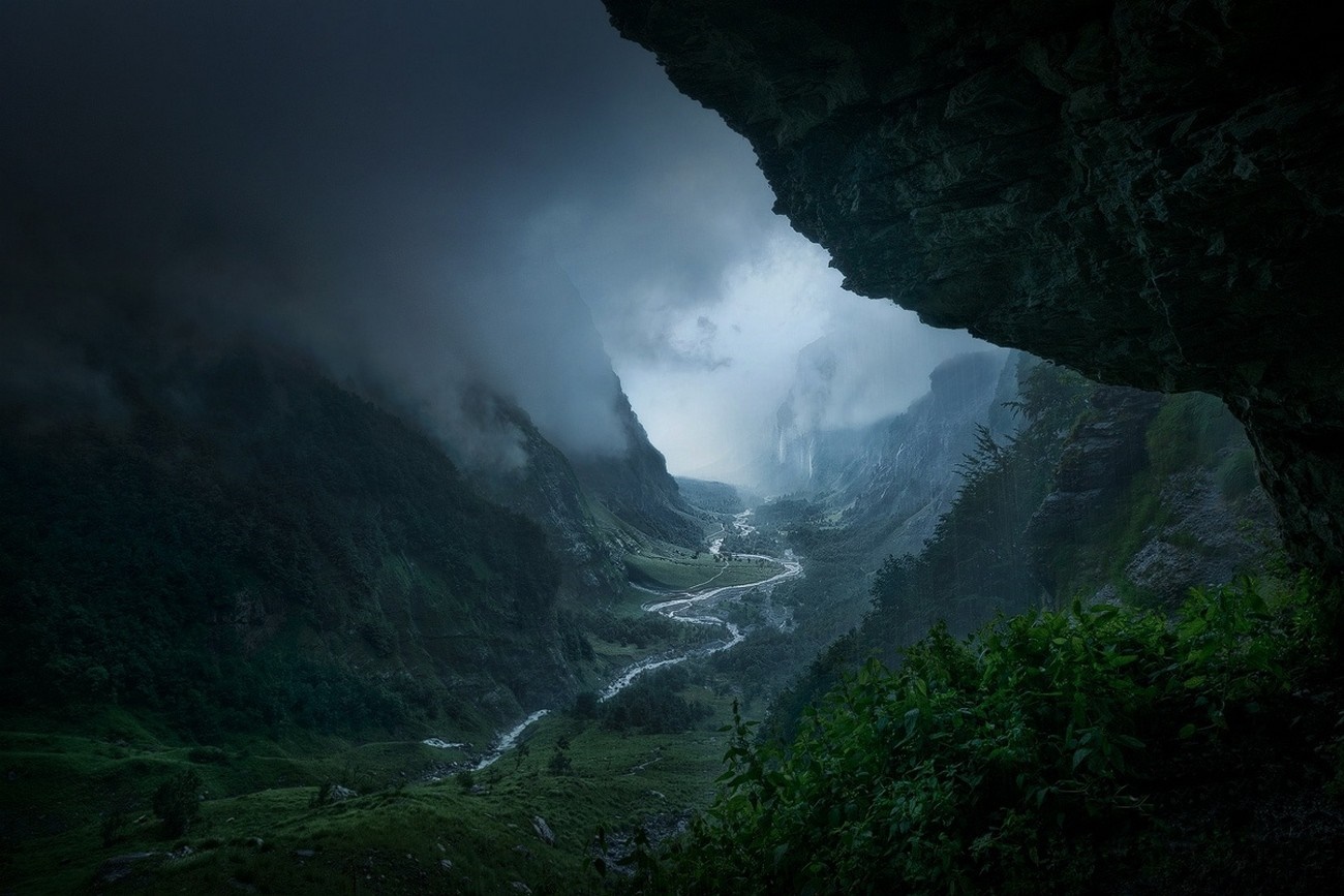 Misty valley with a winding river seen from a cave HD Wallpaper
