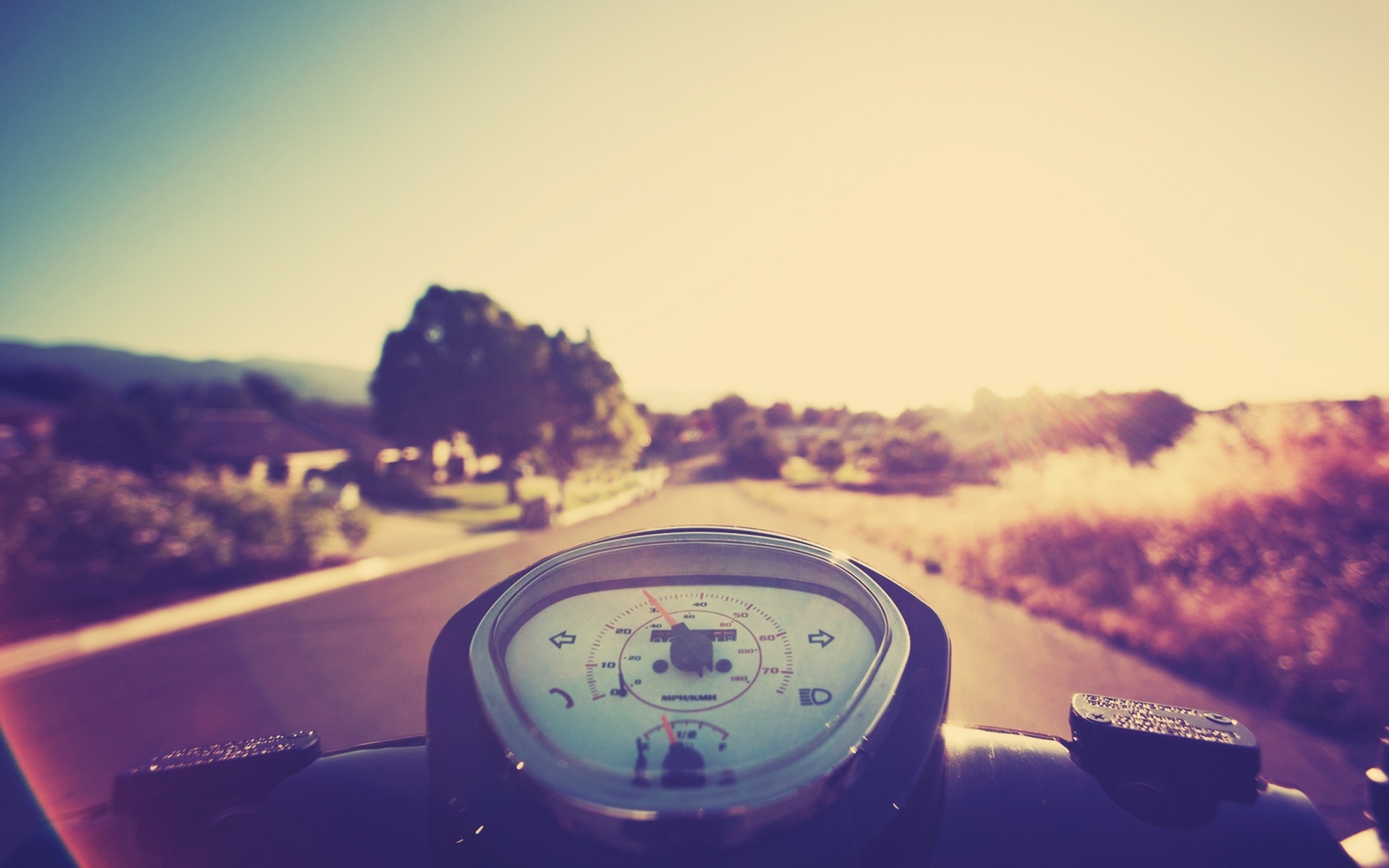 Scooter dashboard on a sunny road trip HD Wallpaper
