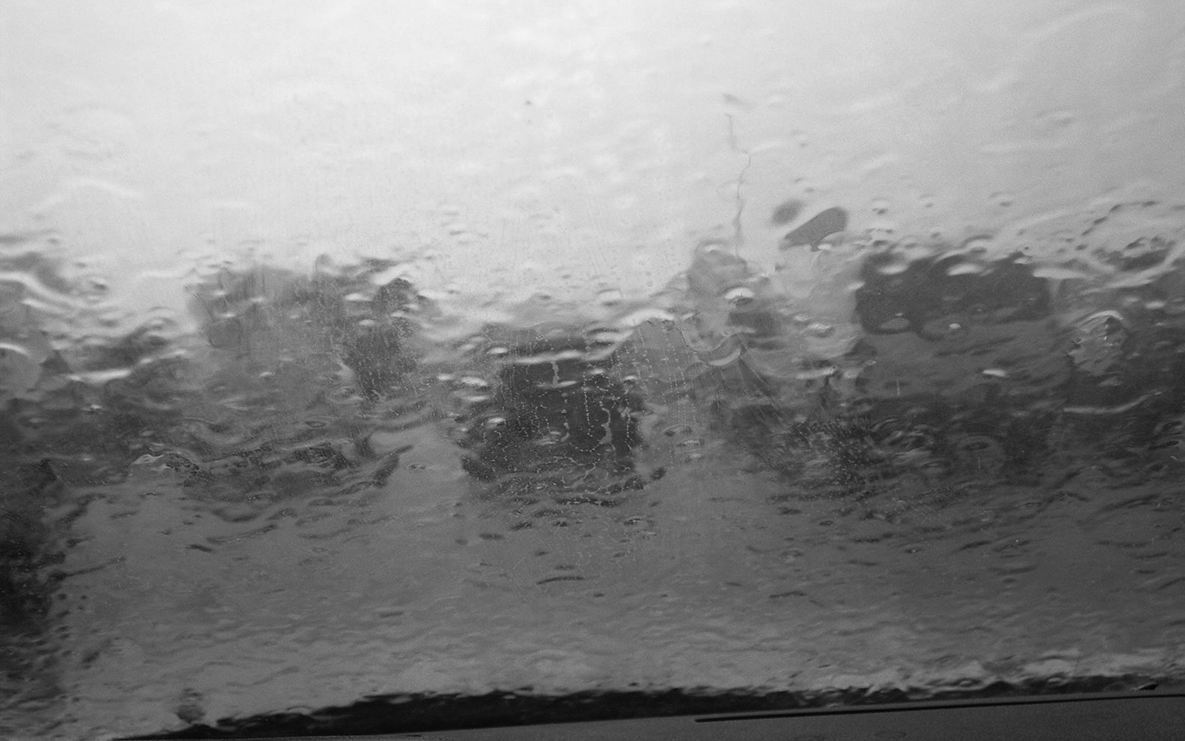 Raindrops on a window with blurred background HD Wallpaper