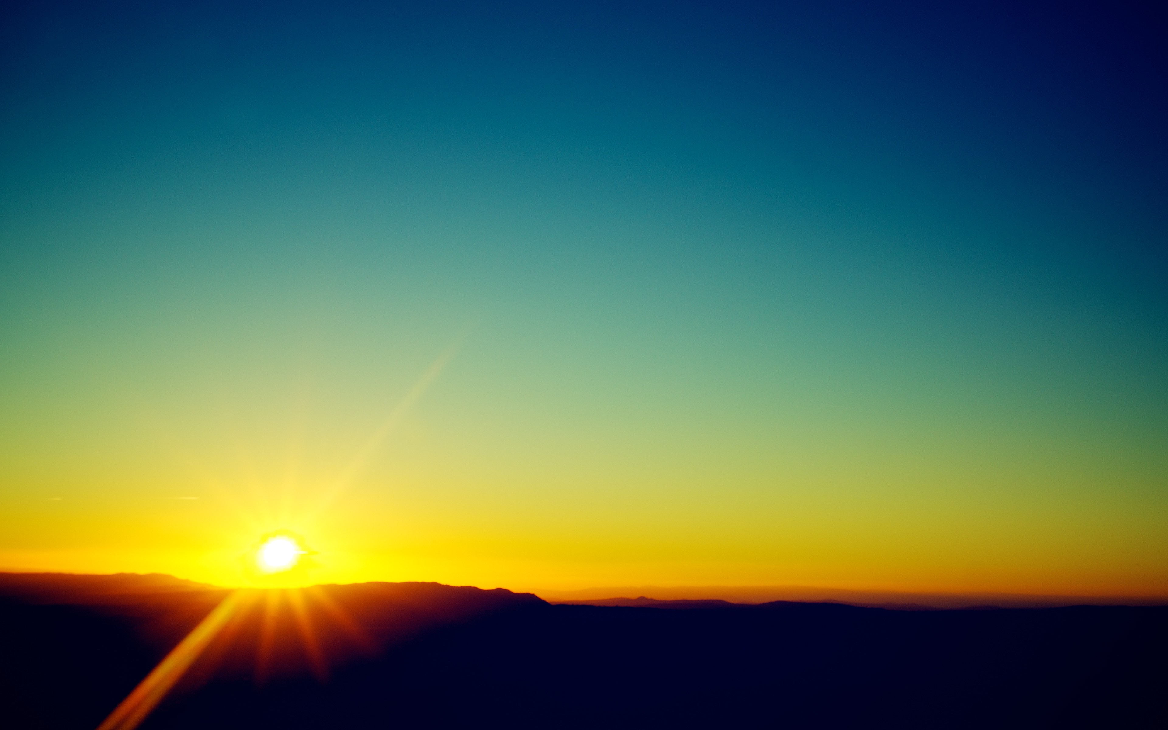 Sunset over mountains with sun rays HD Wallpaper