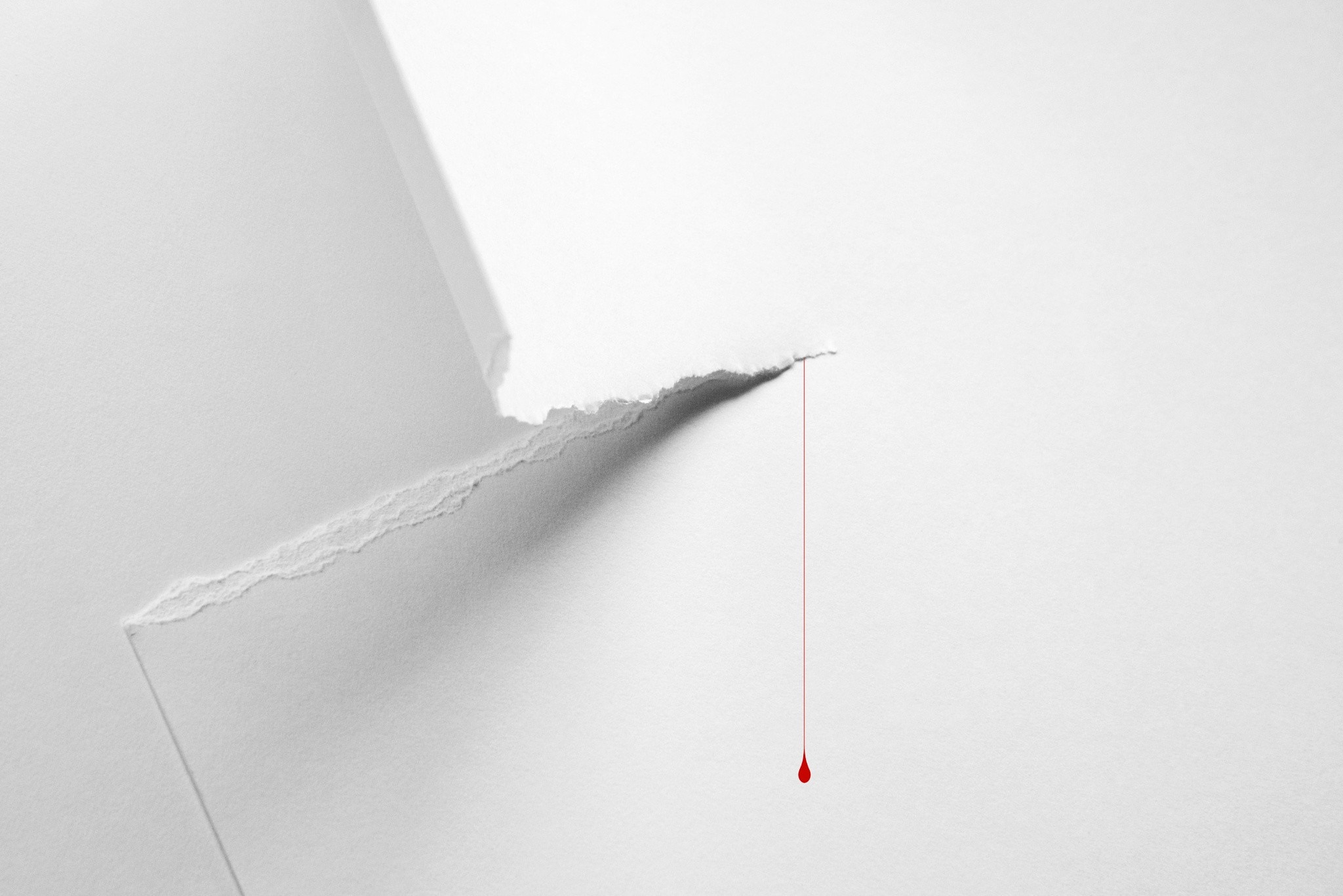 Torn paper with a drop of blood HD Wallpaper