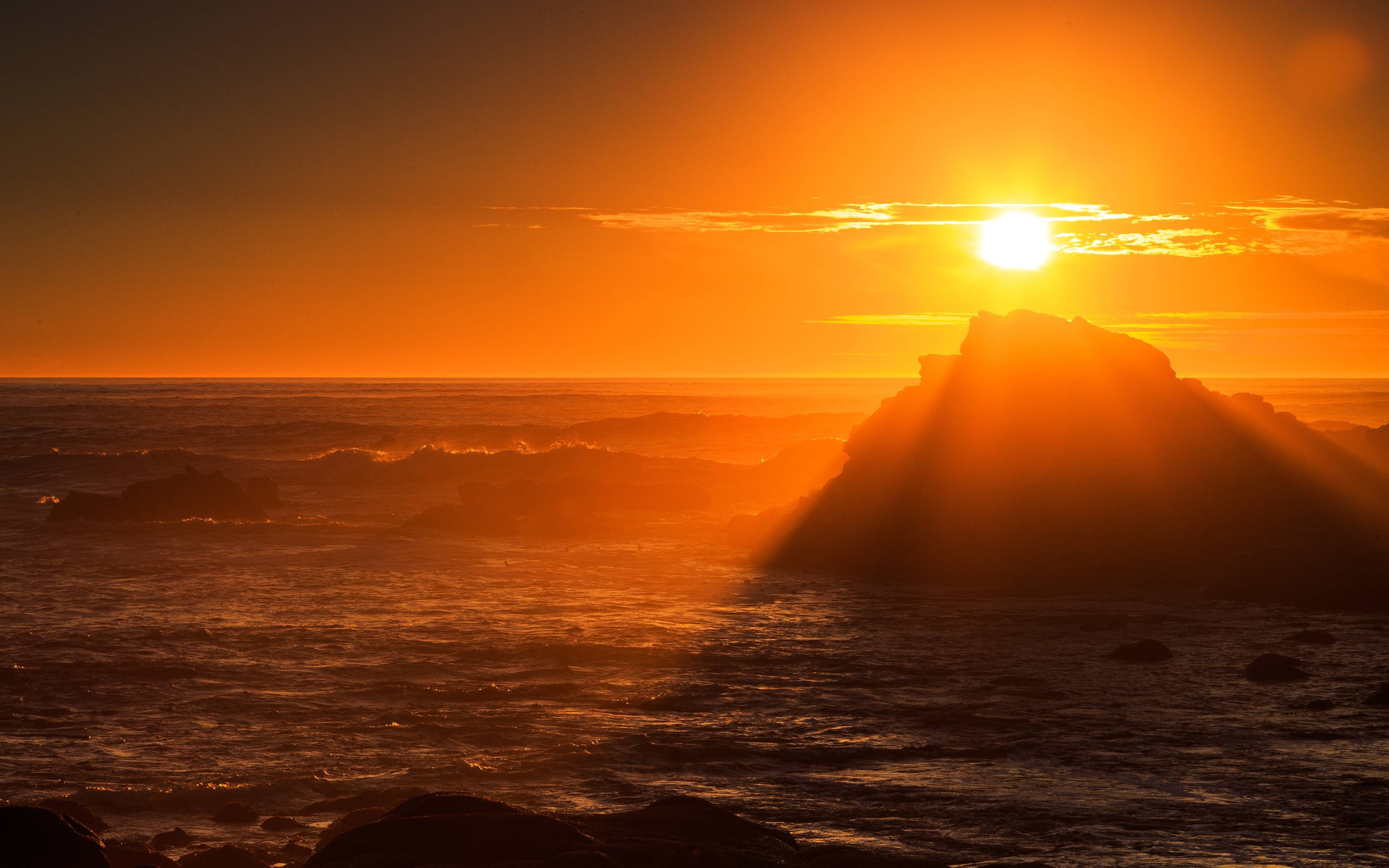 Sunset over the ocean with rocky coast HD Wallpaper