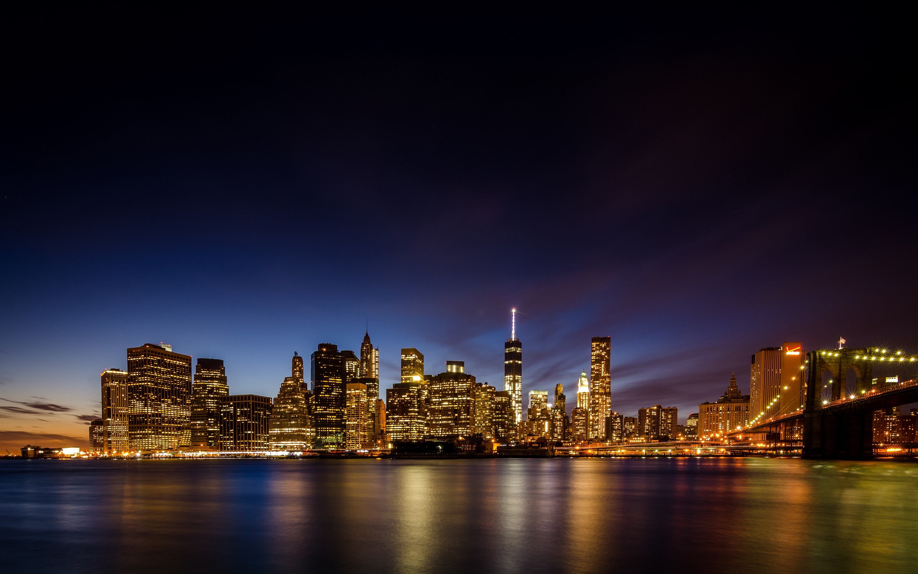 New York City skyline at night with Brooklyn Bridge HD Wallpaper