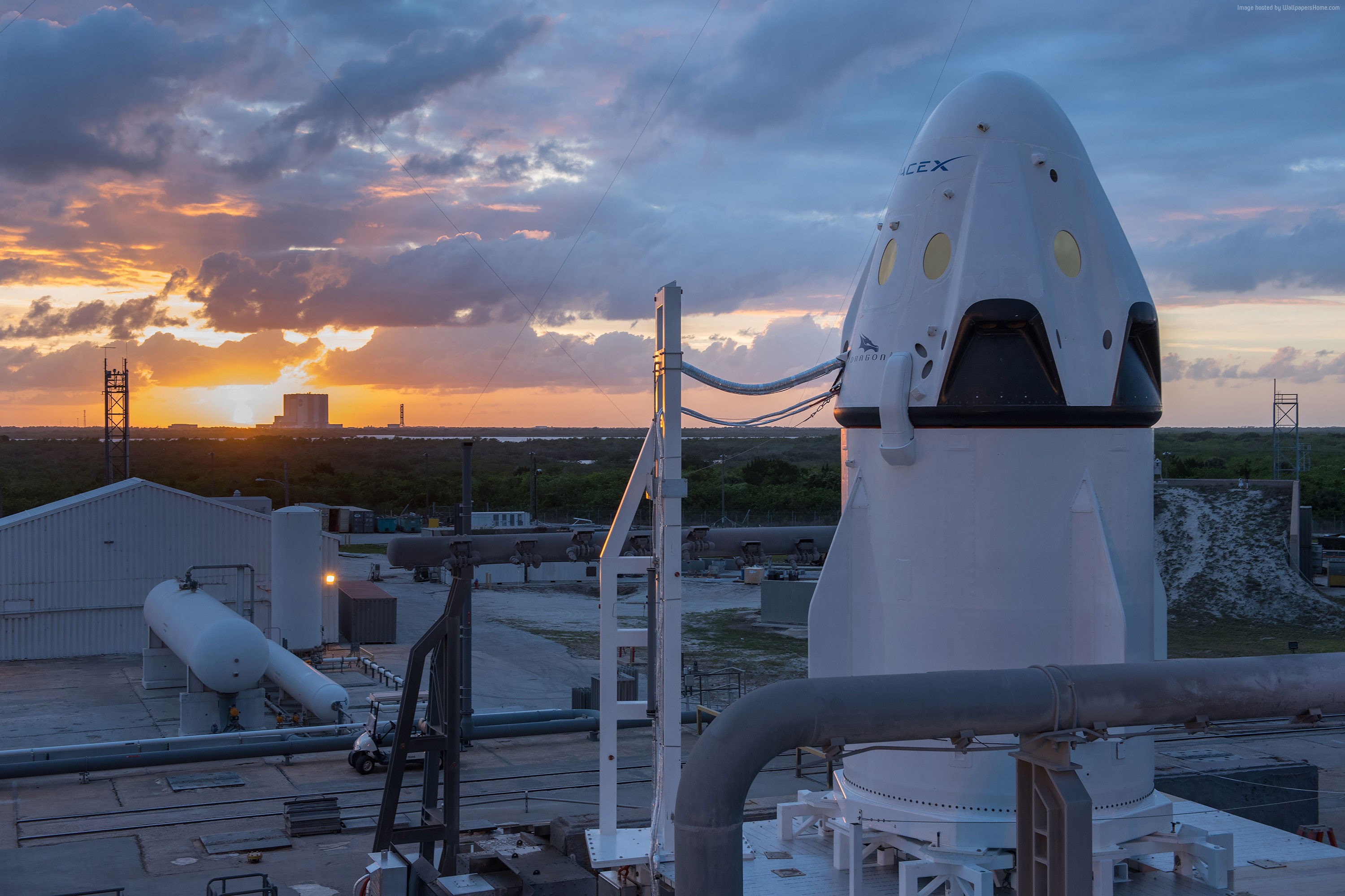 SpaceX Dragon spacecraft at launchpad during sunset HD Wallpaper
