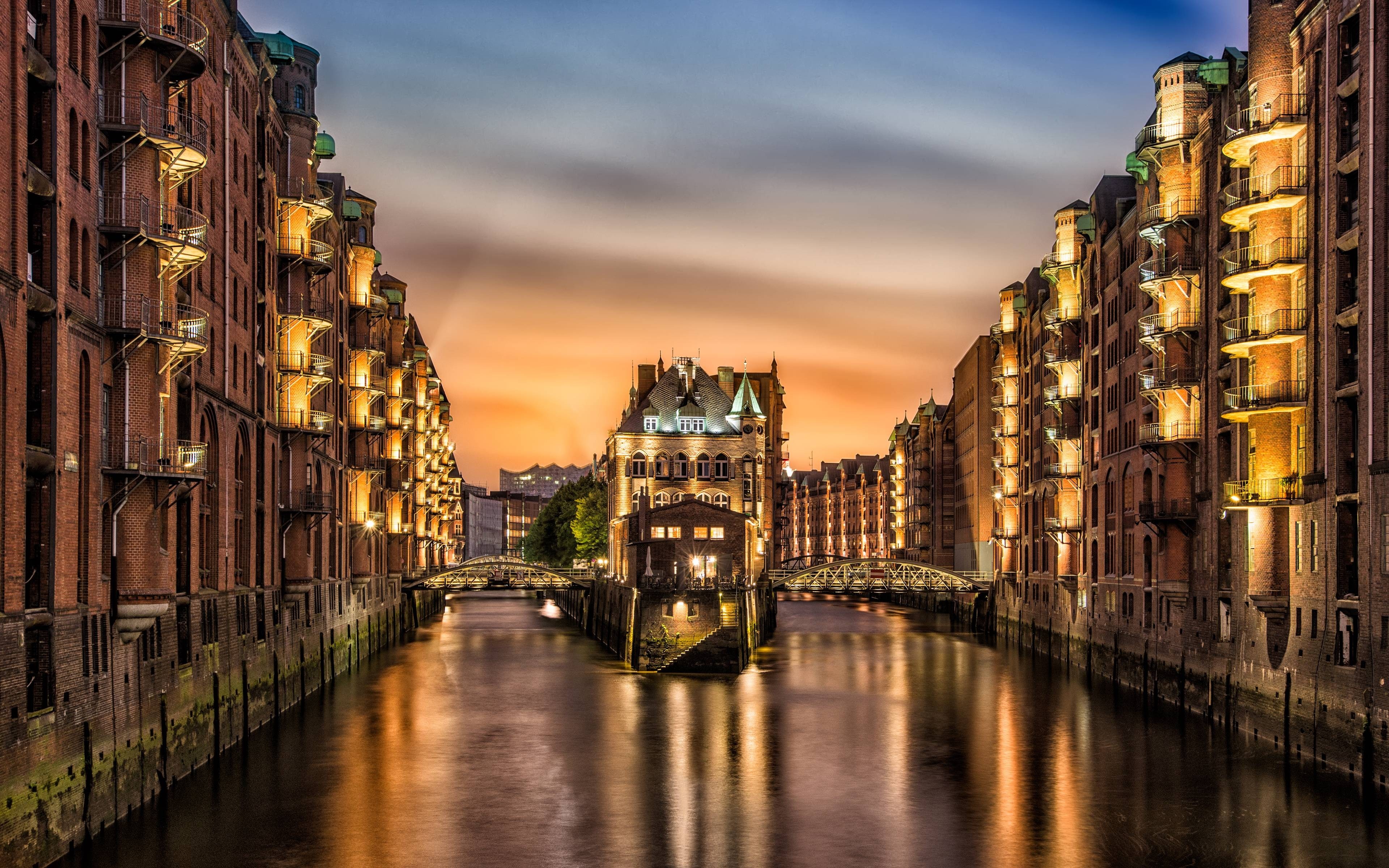Speicherstadt Hamburg at dusk with canal and bridges HD Wallpaper