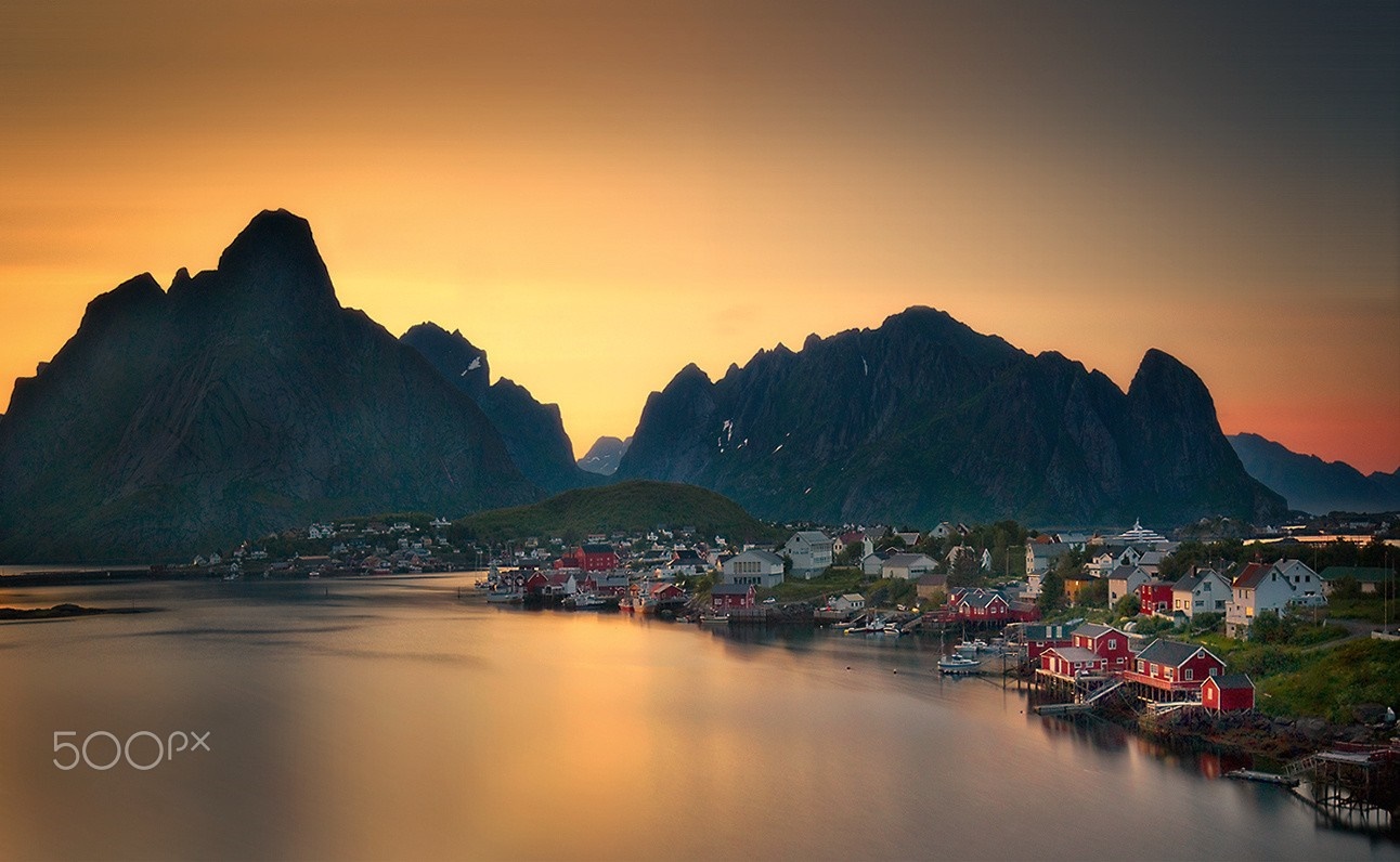 Coastal village at sunset with mountains in Norway HD Wallpaper