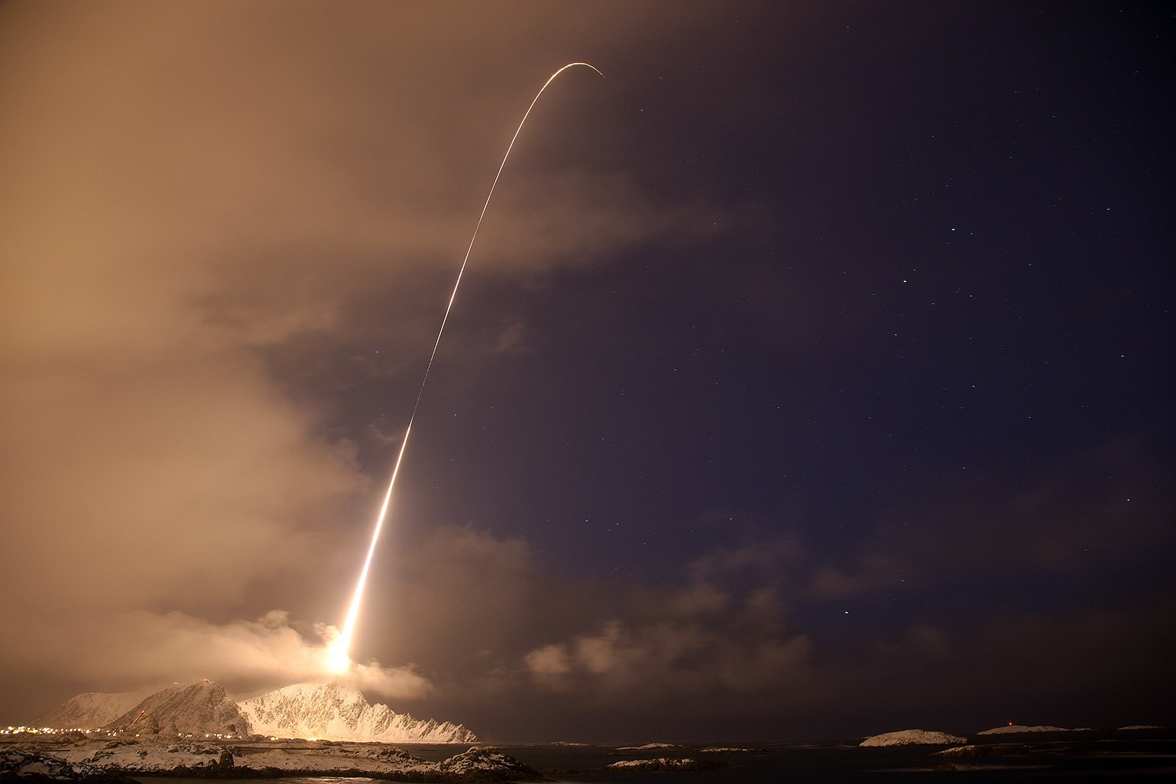 Rocket Launch Trail Over Snowy Mountains at Night HD Wallpaper