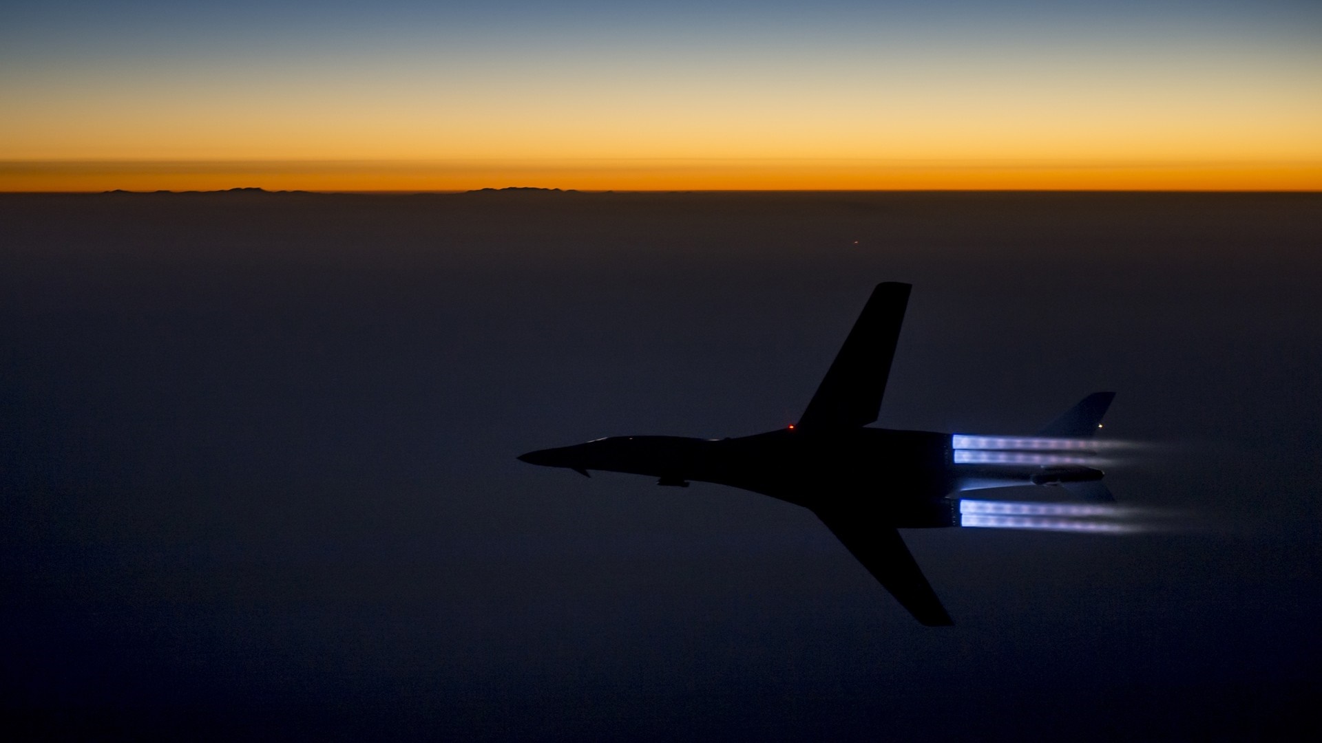 Rockwell B-1 Lancer bomber flying at sunset HD Wallpaper