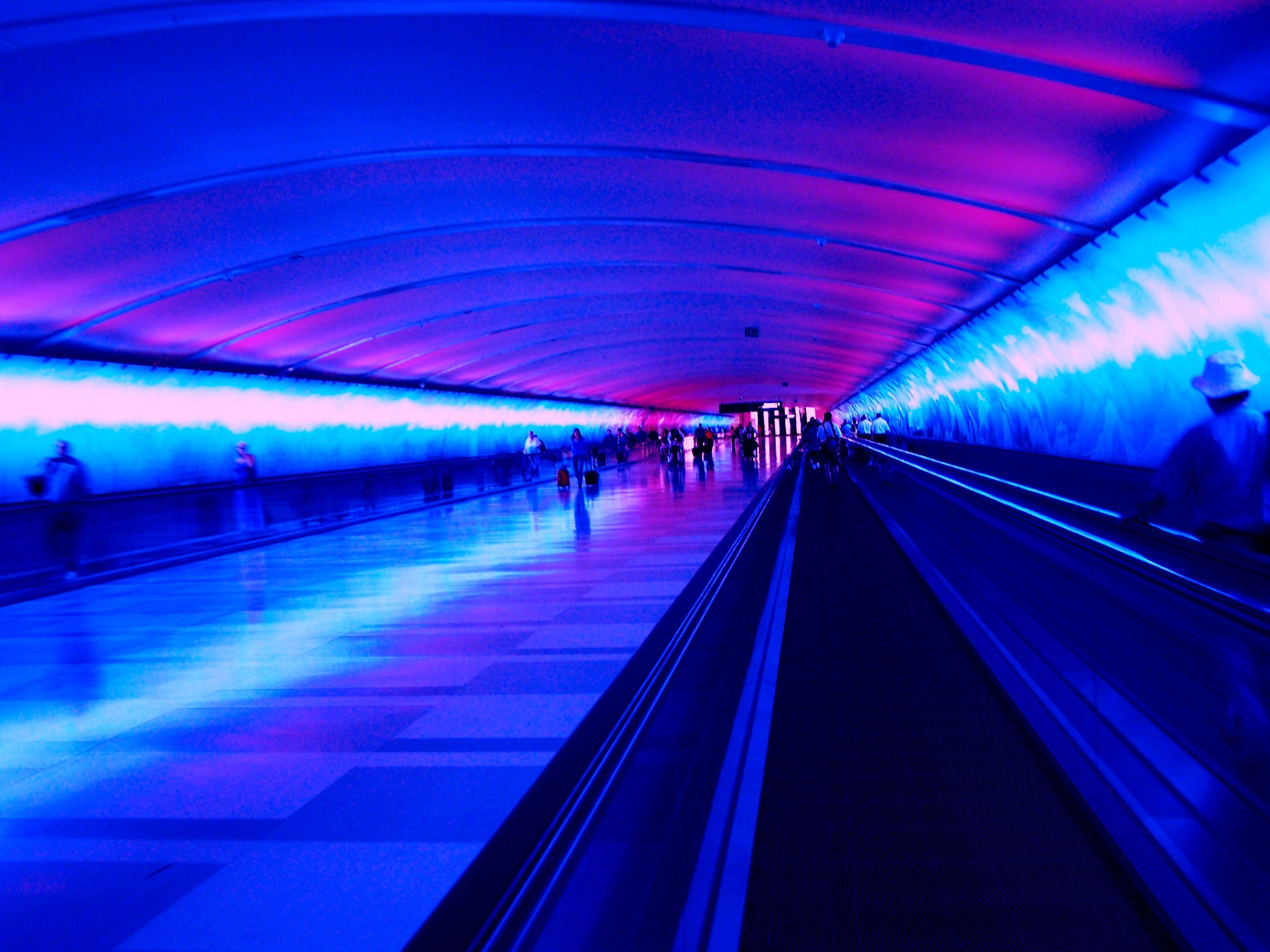 Airport hallway with blue and pink lights HD Wallpaper