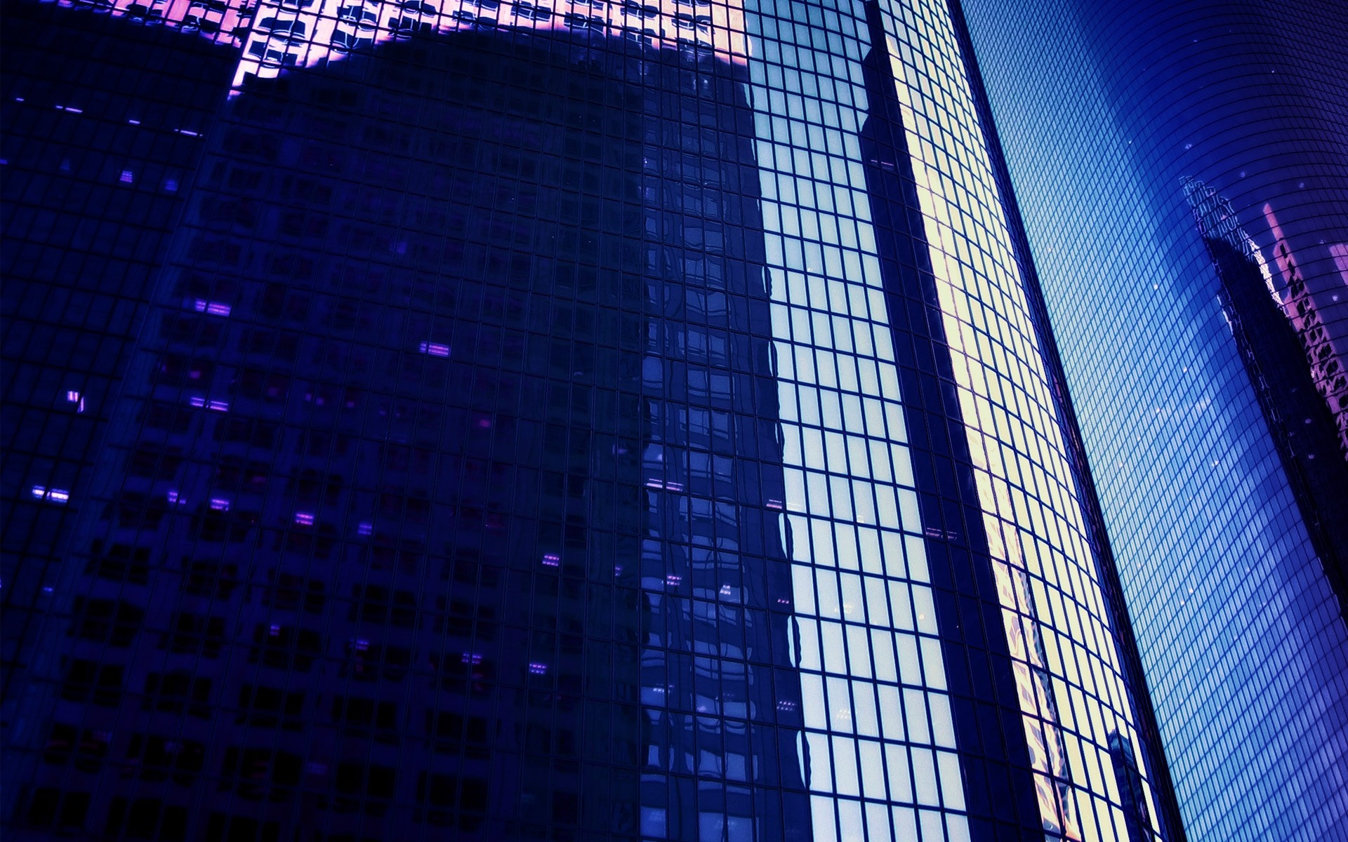 Modern skyscrapers with glass facades at night HD Wallpaper