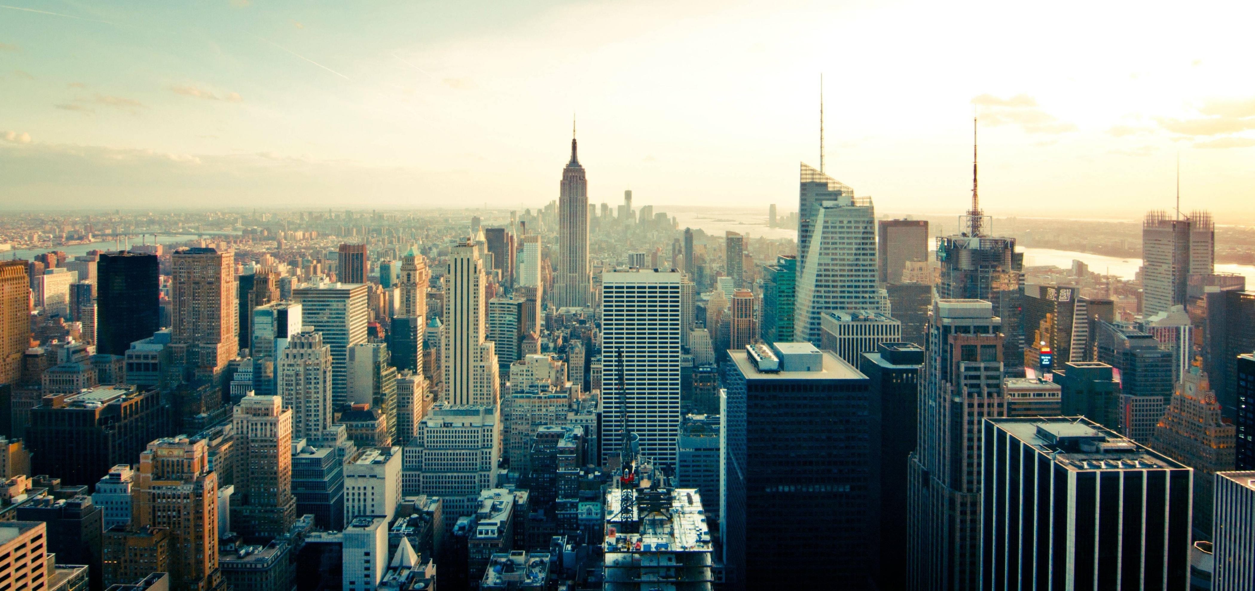 New York City skyline at dusk with Empire State Building HD Wallpaper