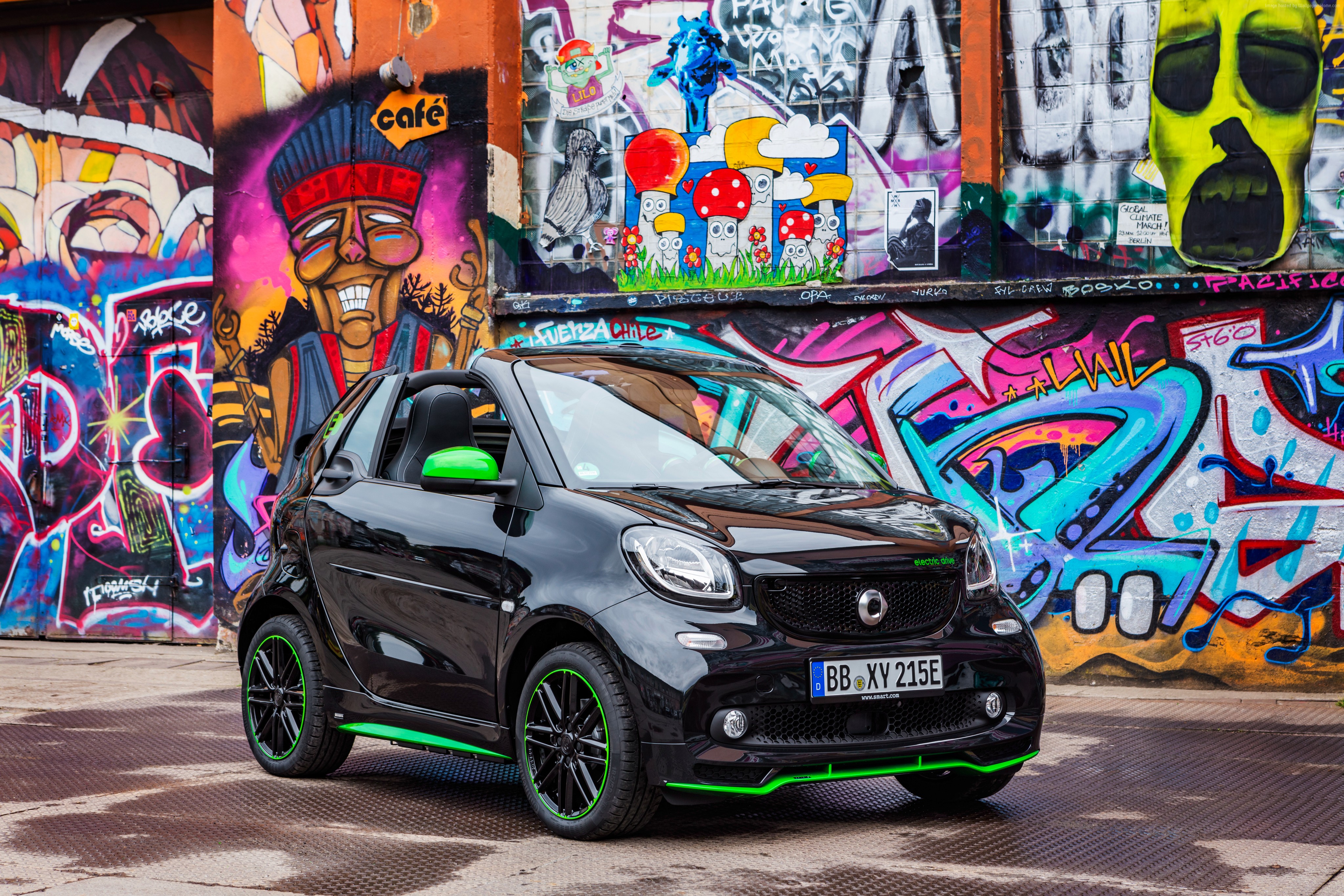 Black Smart ForTwo Electric Car with Green Accents and Graffiti Wall HD Wallpaper