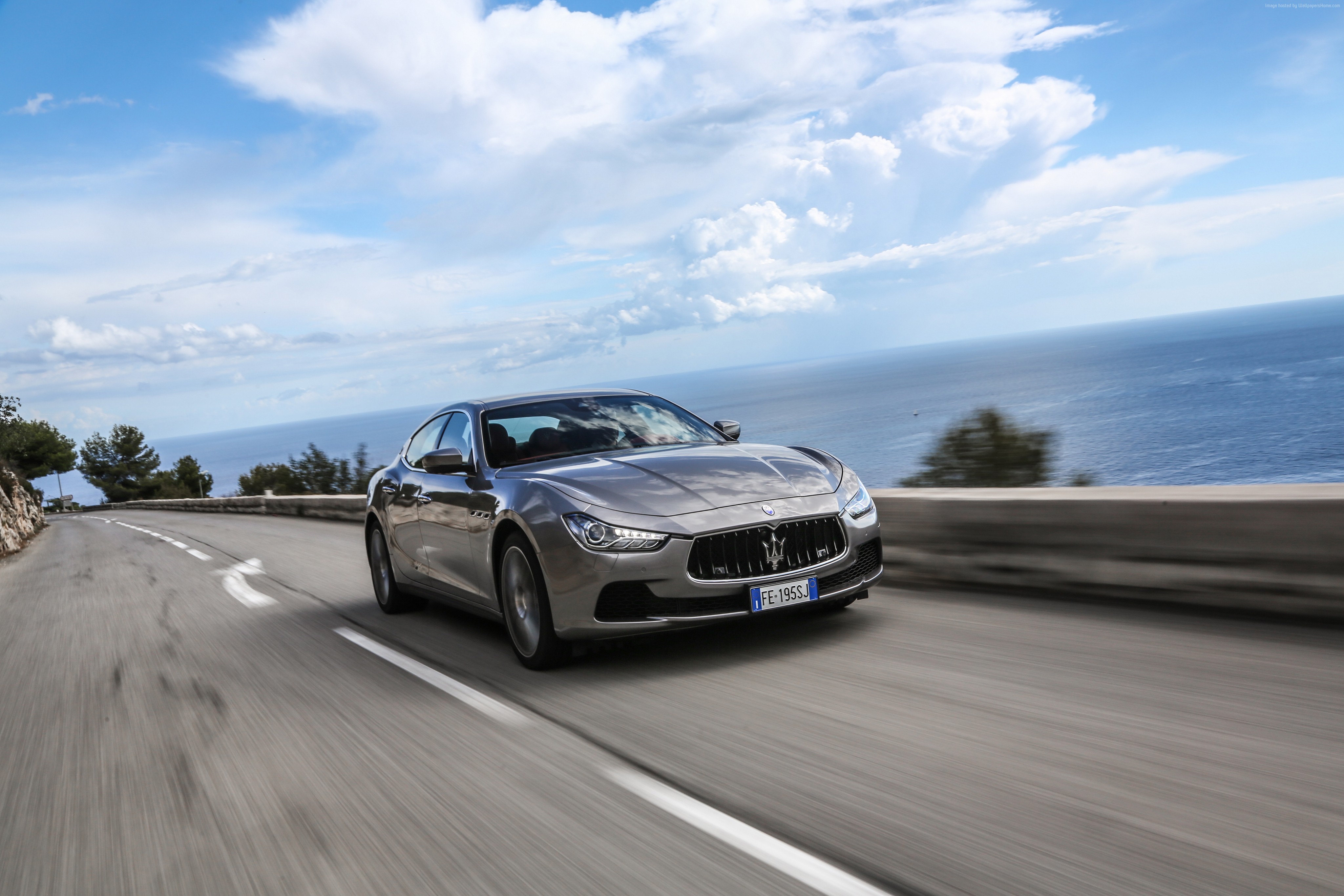 Maserati Ghibli S Q4 driving on coastal road HD Wallpaper