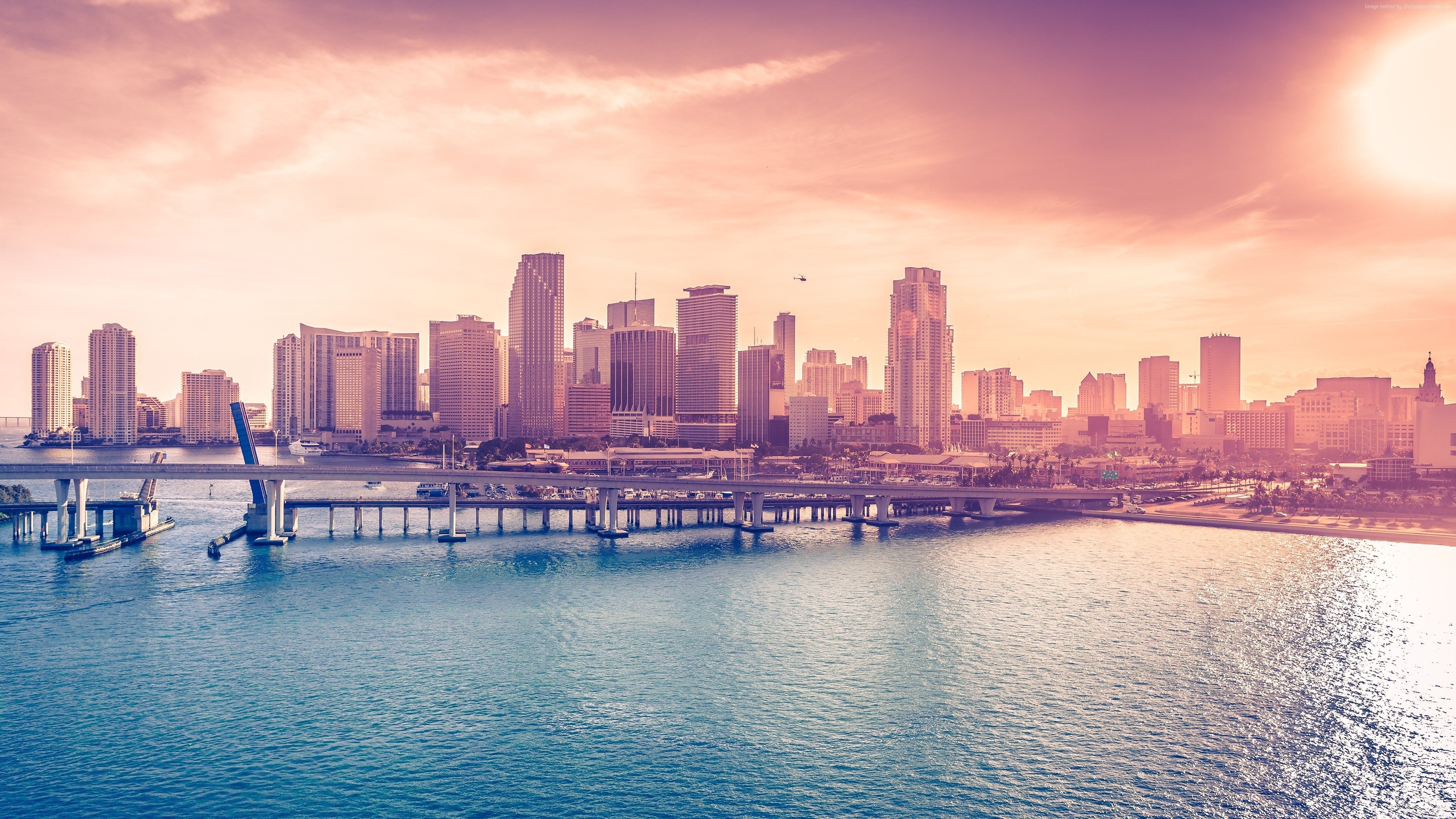 Miami cityscape with skyscrapers and bridge at sunset HD Wallpaper