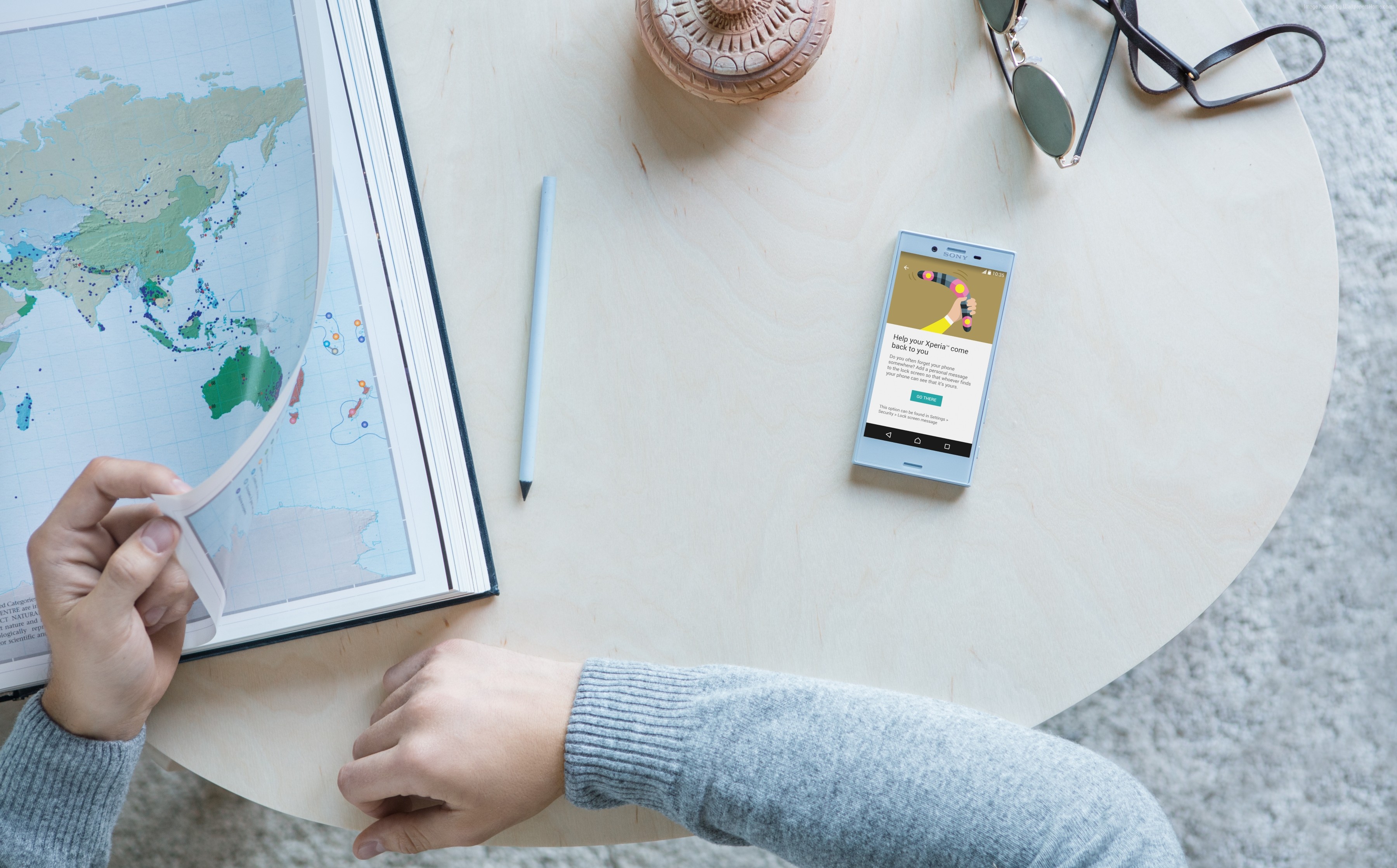 Sony Xperia X Compact smartphone on a table with a map HD Wallpaper