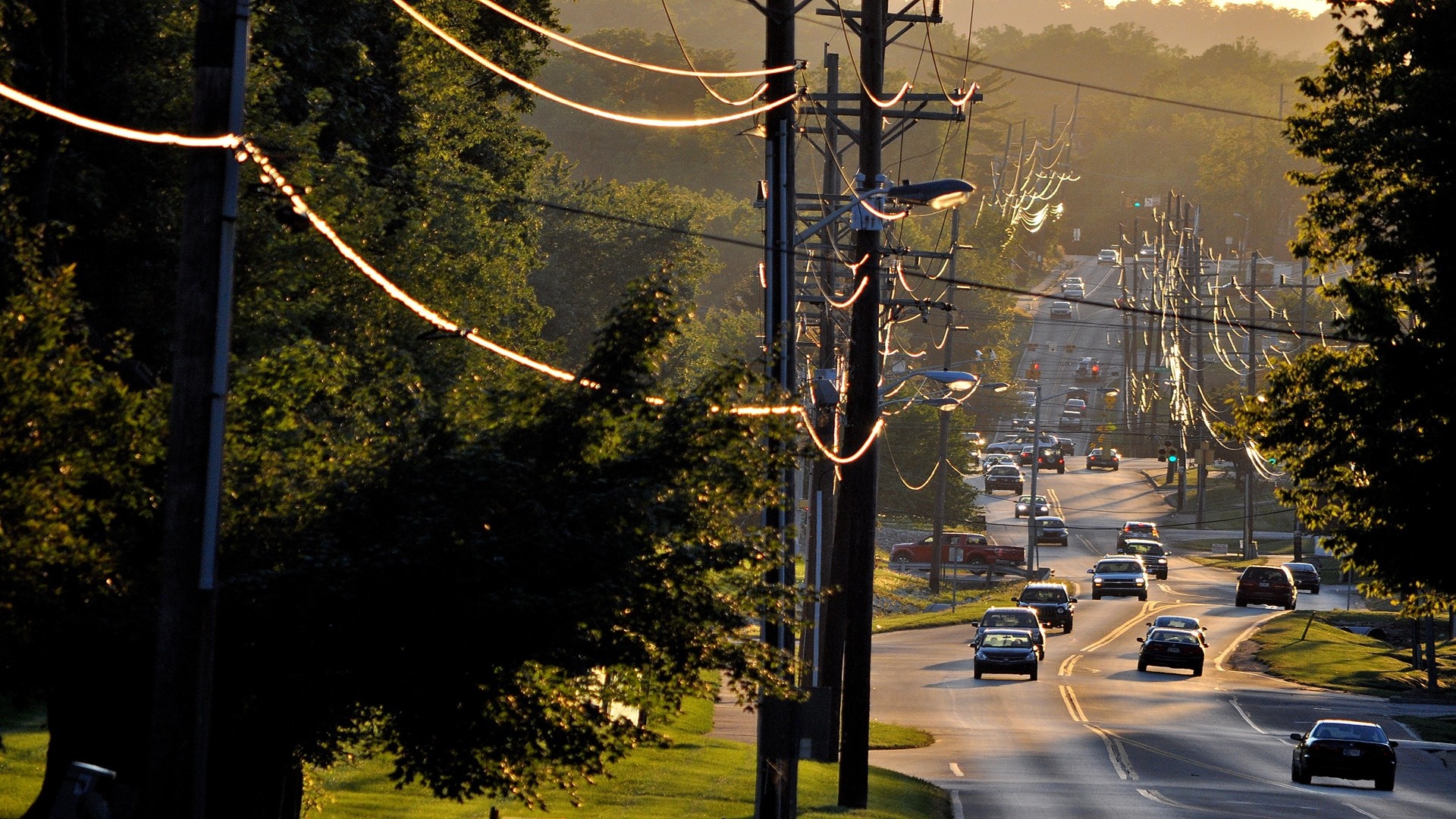 Street scene with cars and power lines at sunset HD Wallpaper