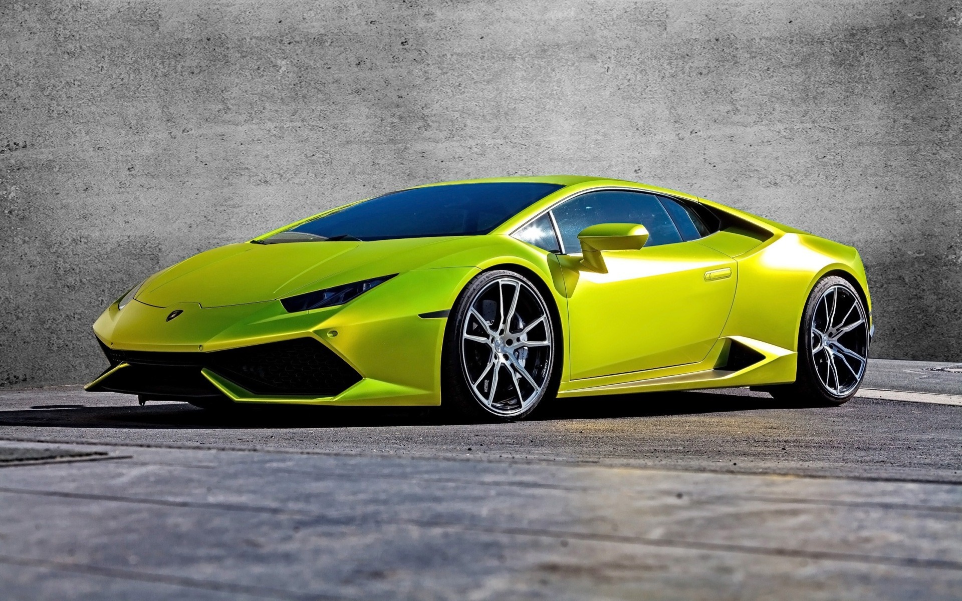 Lime green Lamborghini Huracan parked on concrete HD Wallpaper