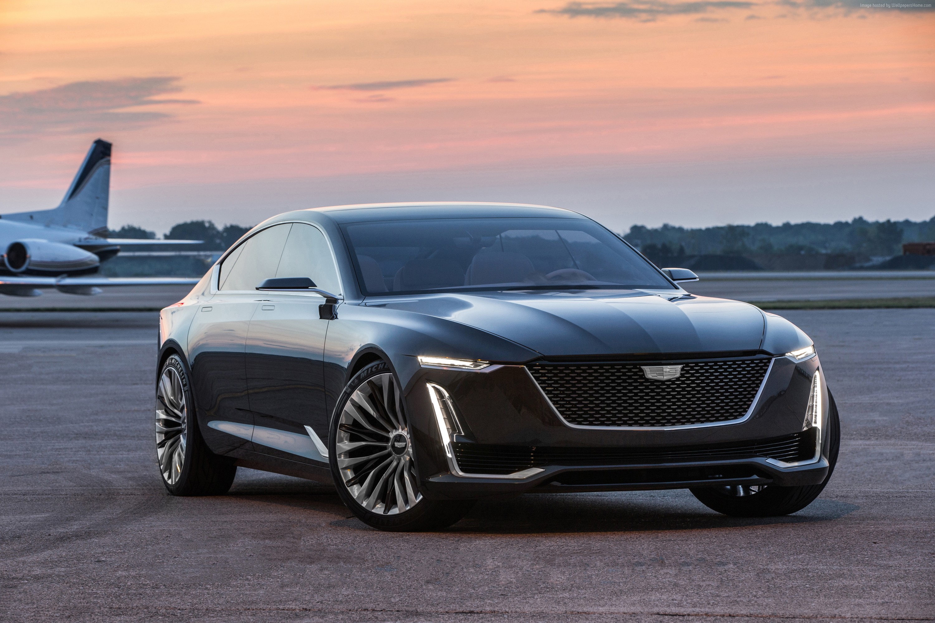 Cadillac Escala concept sedan on tarmac with private jet HD Wallpaper
