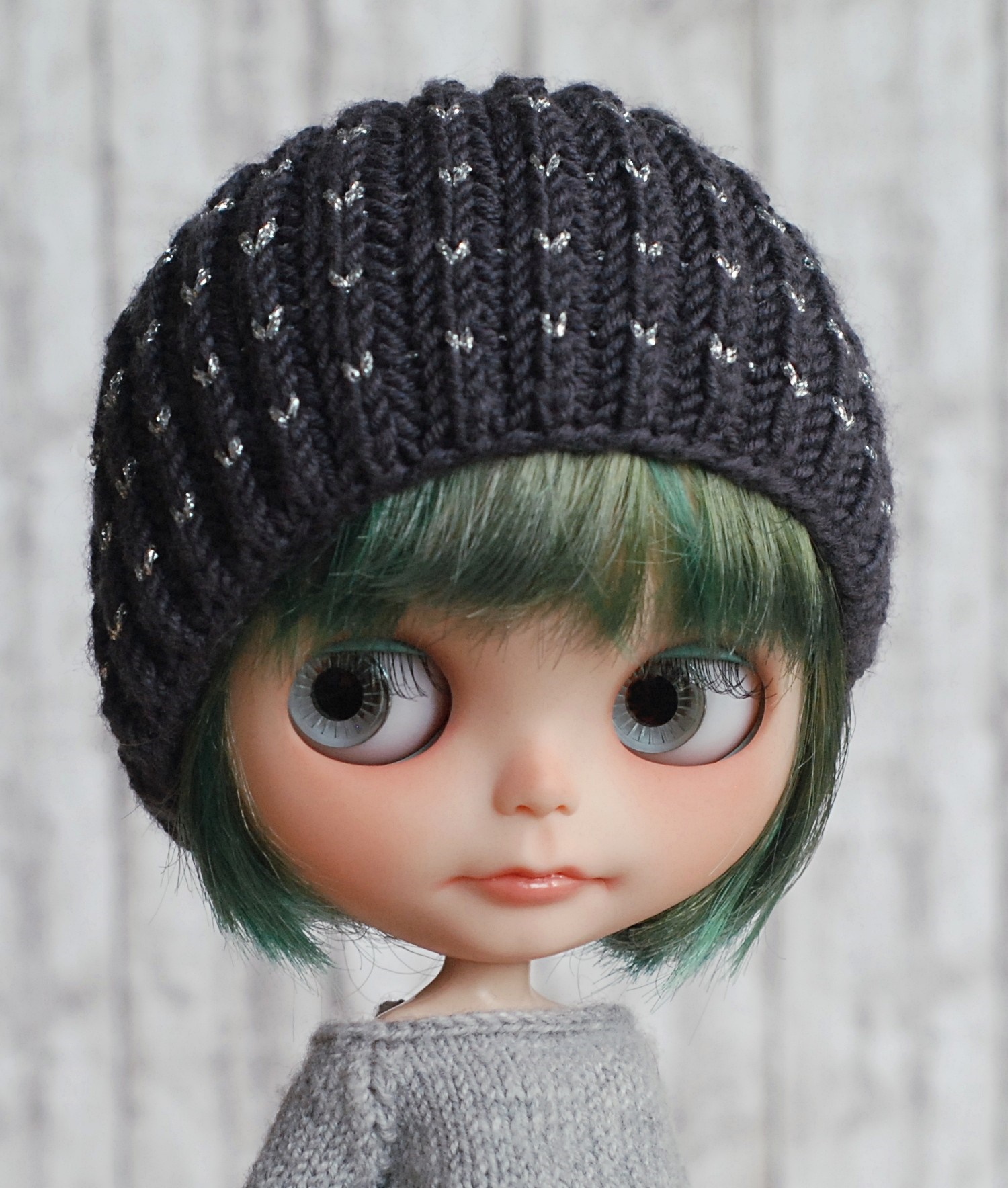 Doll wearing a knitted hat and sweater HD Wallpaper