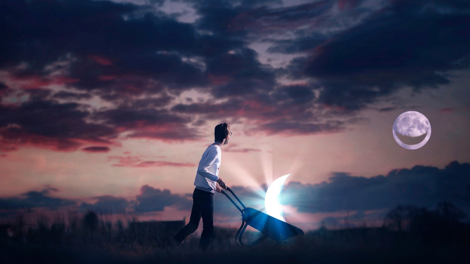 Man pushing wheelbarrow with crescent moon at sunset HD Wallpaper