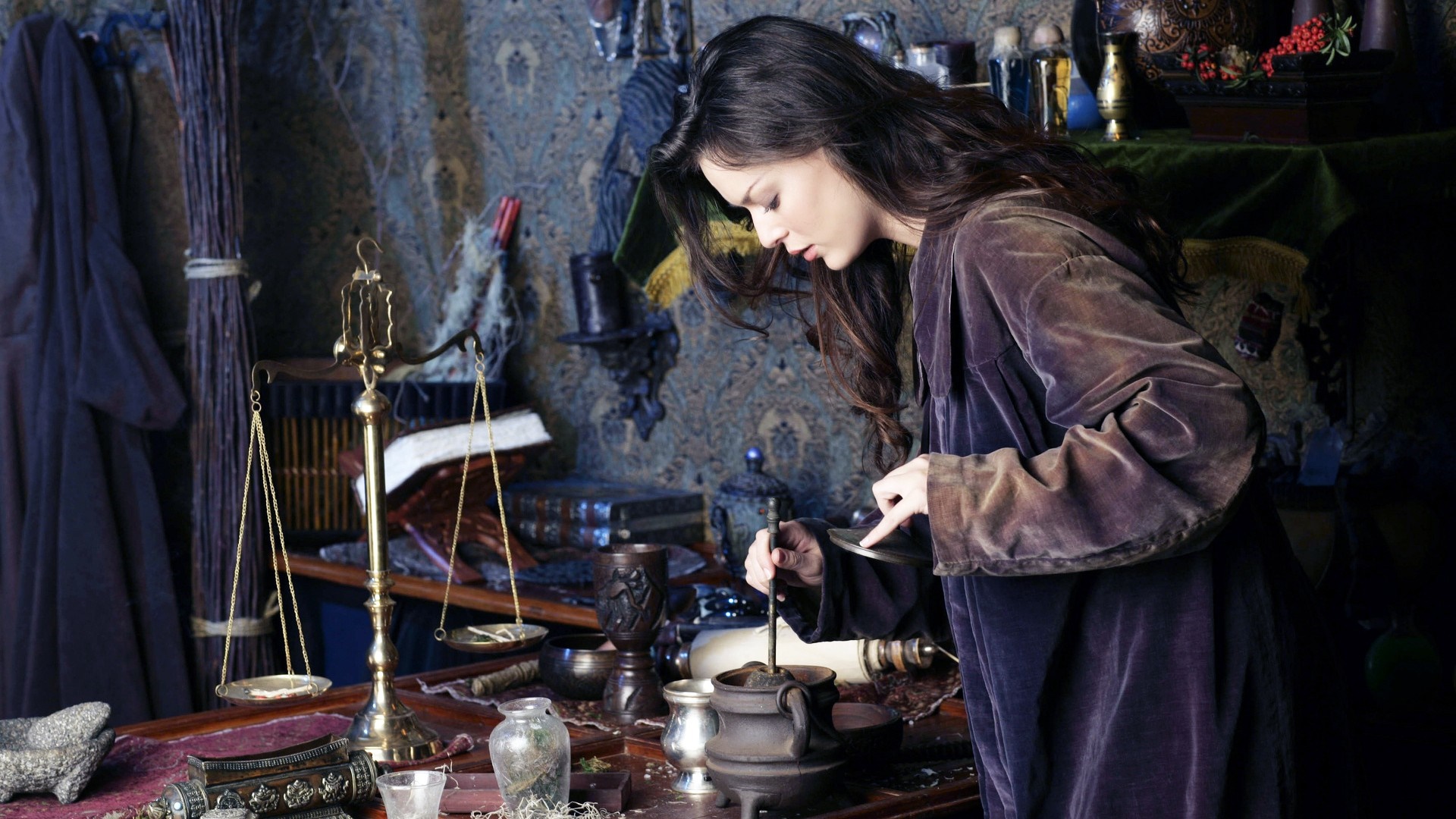 Woman in a dark room with scales and potions HD Wallpaper
