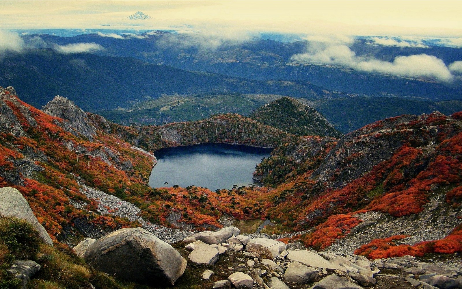 Autumnal mountain lake with distant volcano and clouds HD Wallpaper