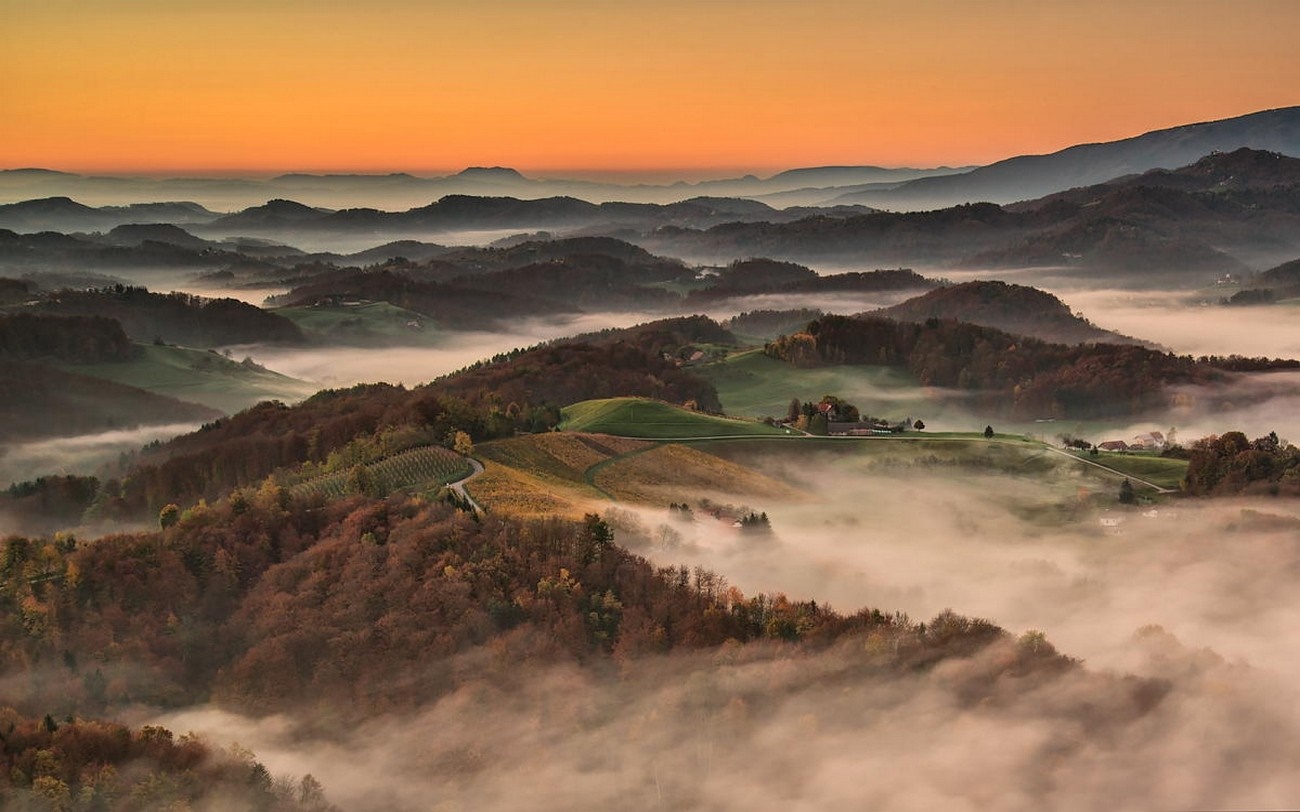 Misty valley and hills at sunrise in Slovenia HD Wallpaper