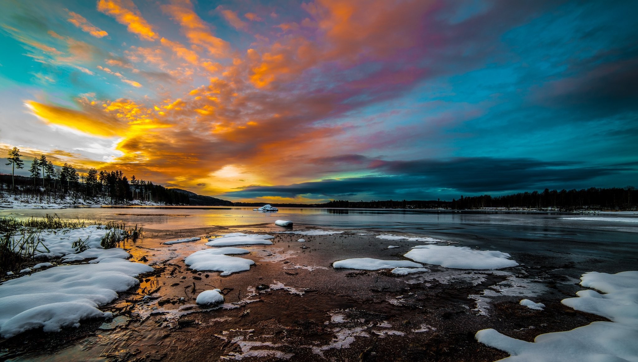 Sunset over a frozen lake with colorful clouds HD Wallpaper