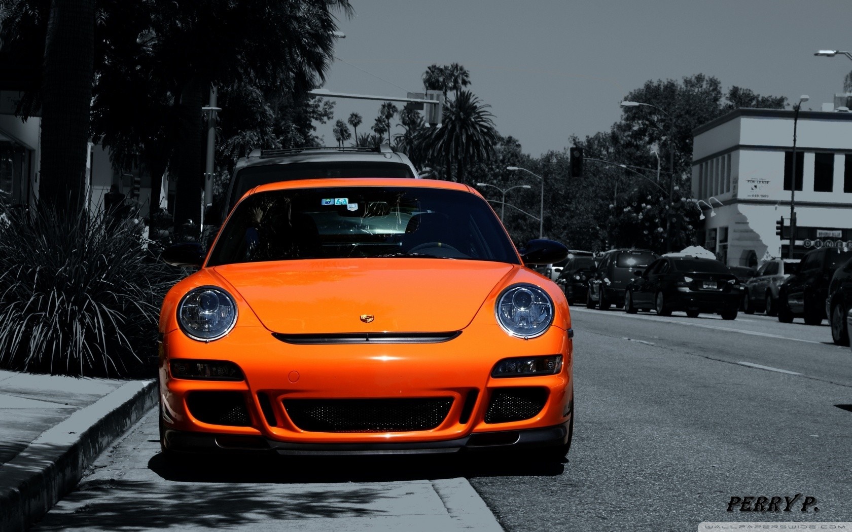 Orange Porsche 911 GT3 parked on a street HD Wallpaper
