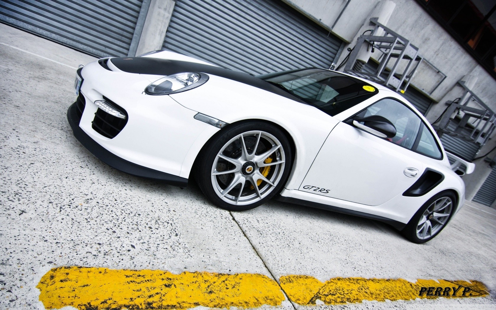 White Porsche GT2RS sports car parked on concrete HD Wallpaper