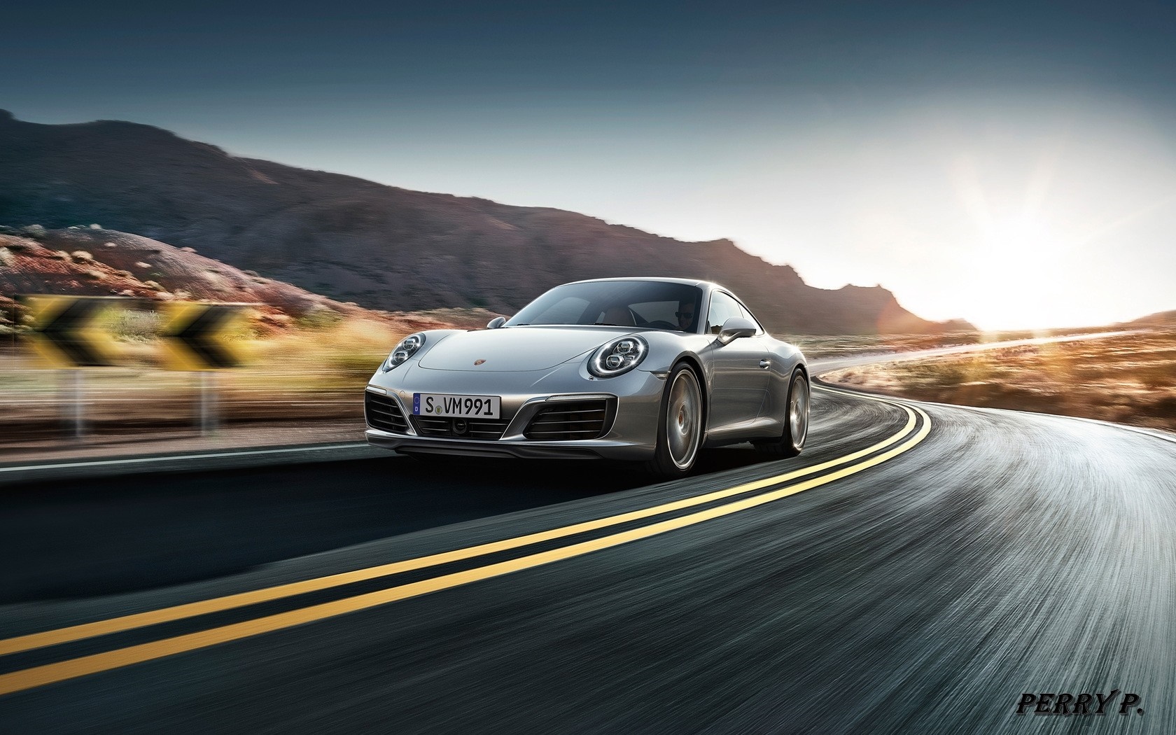 Silver Porsche 911 driving on a winding road HD Wallpaper