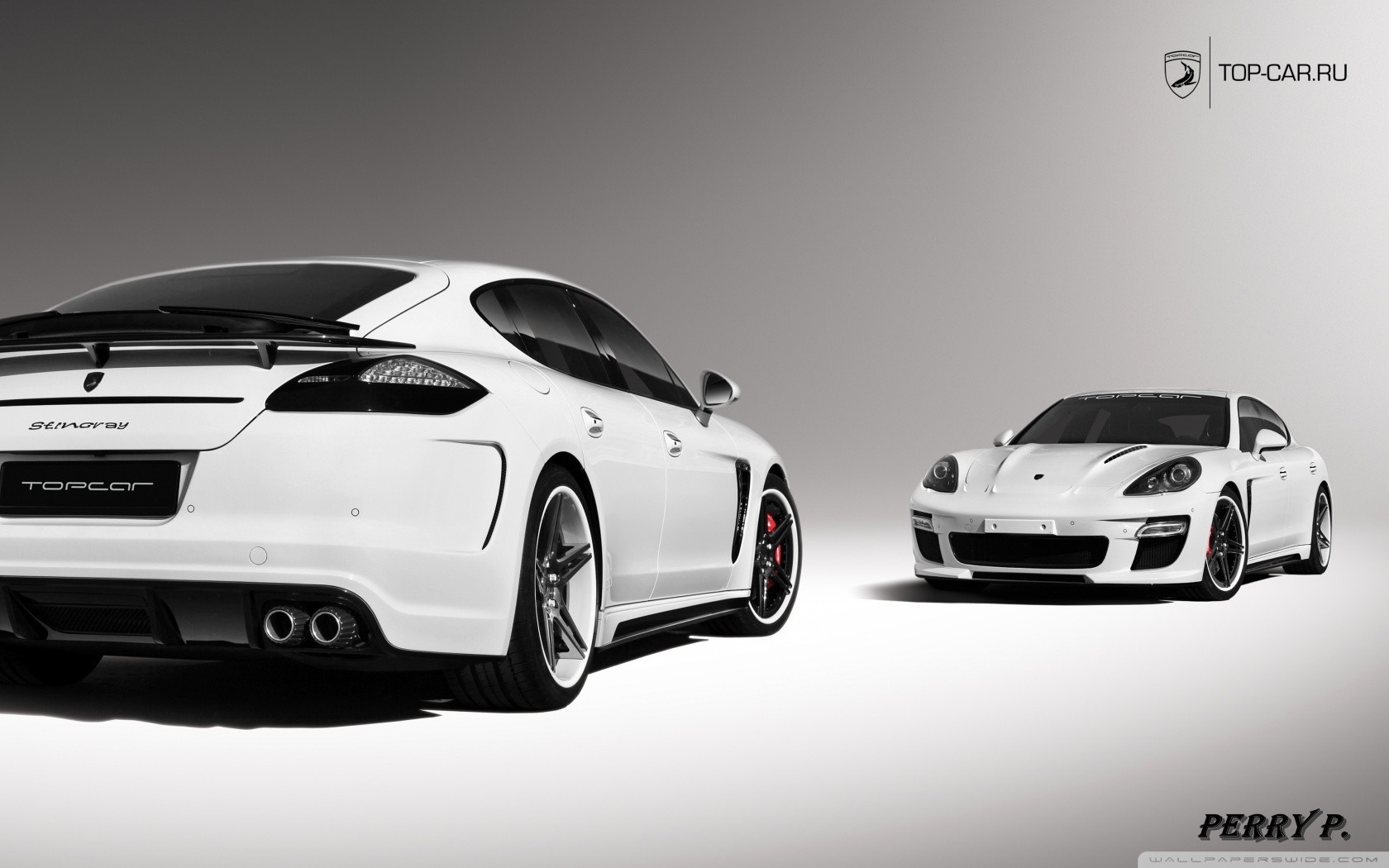 Two white Porsche Panamera cars HD Wallpaper