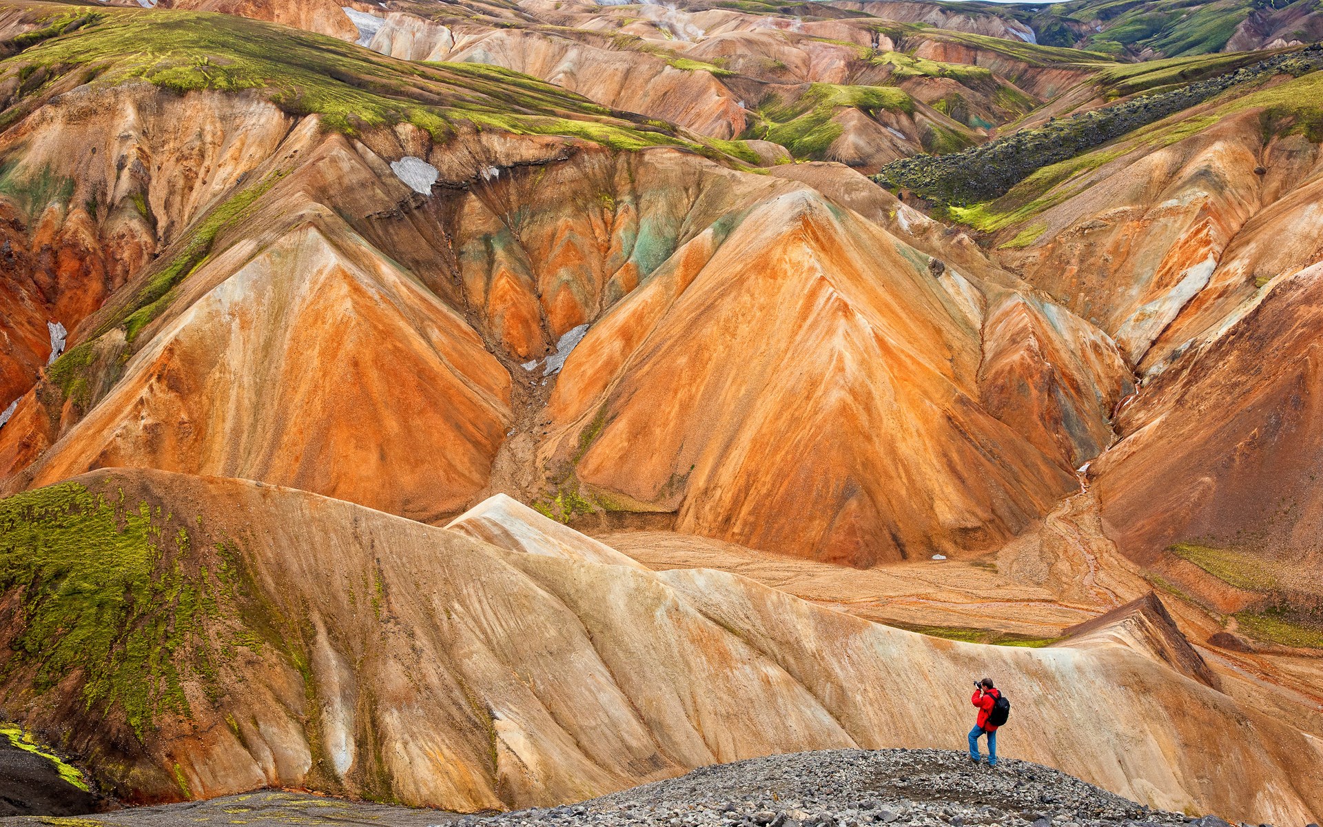 Photographer in colorful Rhyolite Mountains HD Wallpaper