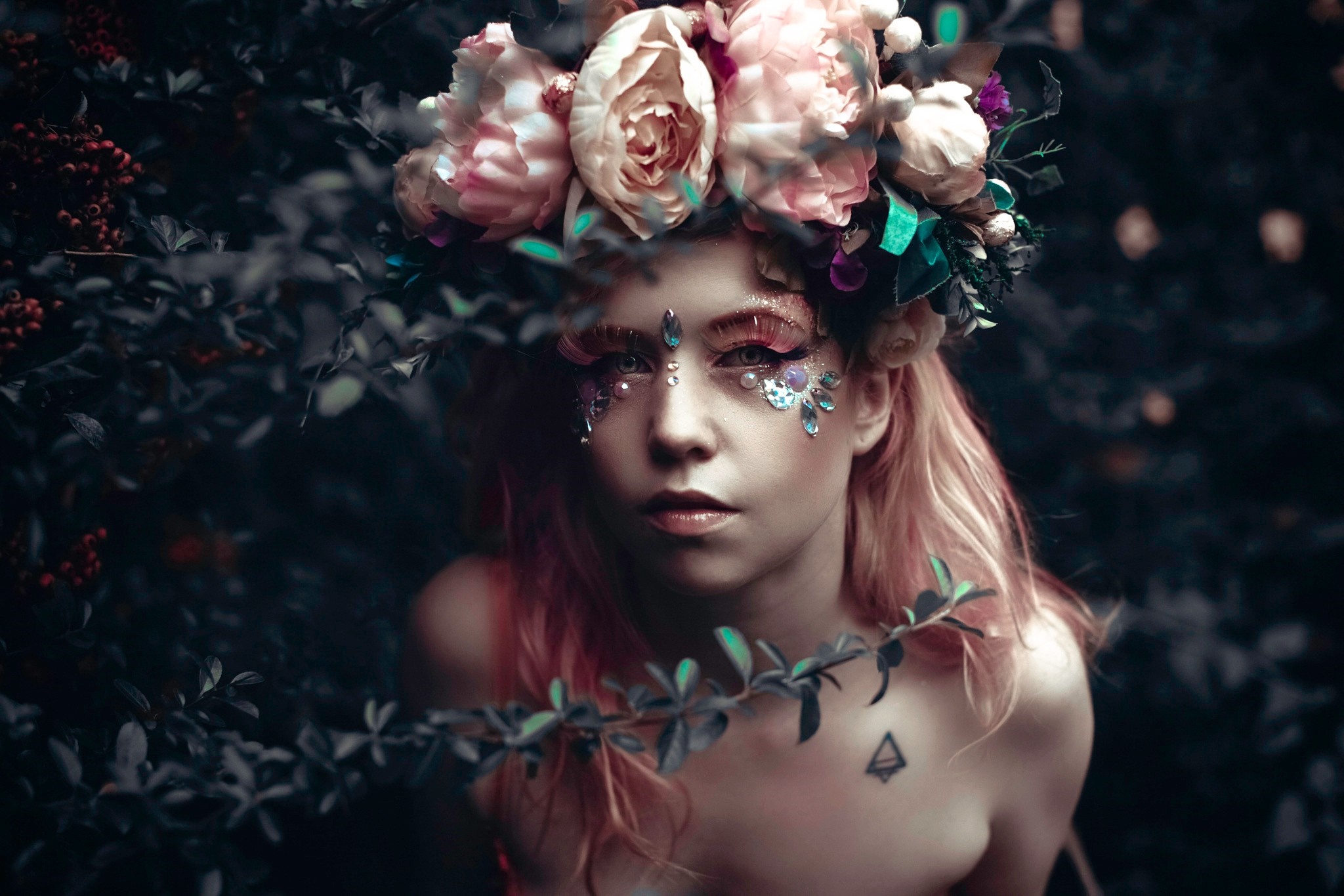 Woman with flower crown and face gems HD Wallpaper