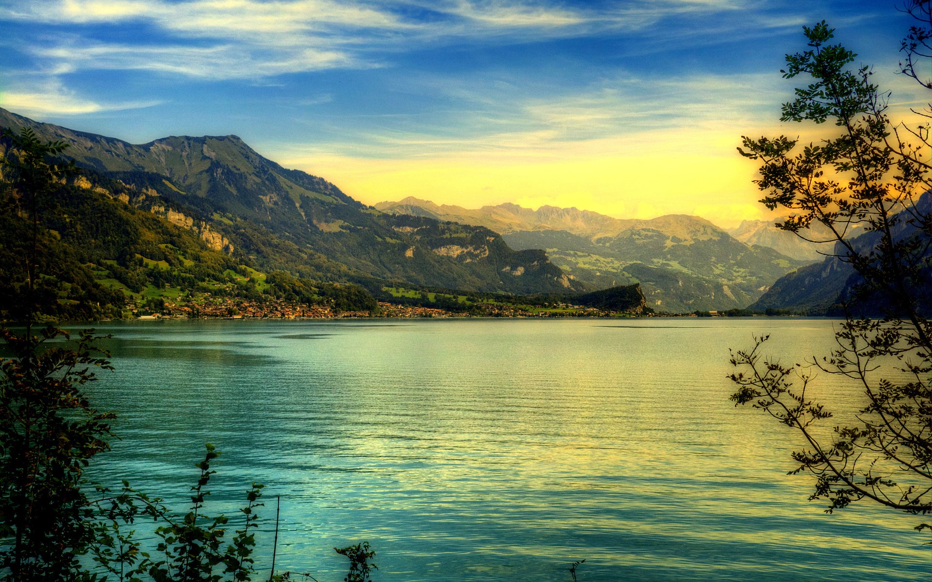Lake and mountains with a village HD Wallpaper
