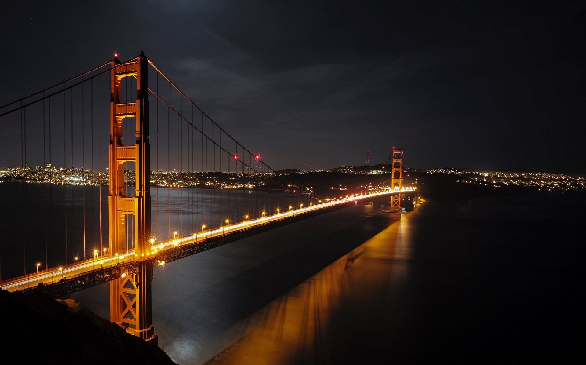 Golden Gate Bridge at night with city lights HD Wallpaper